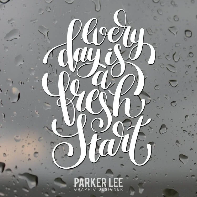 Inspirational quote reading 'Every day is a fresh start' in white script on a grey textured background.