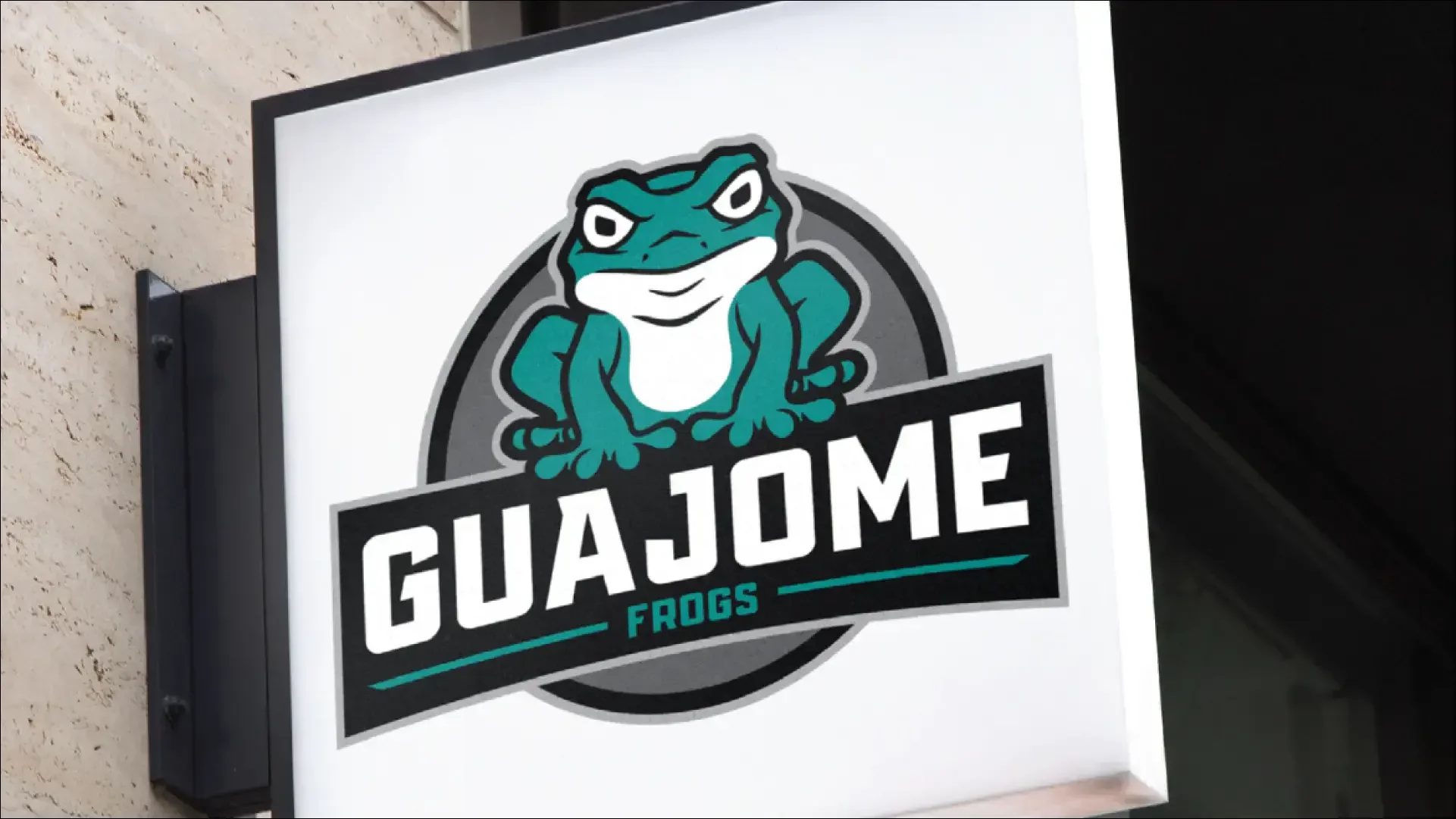 Guajome Frogs mascot logo on a storefront sign.