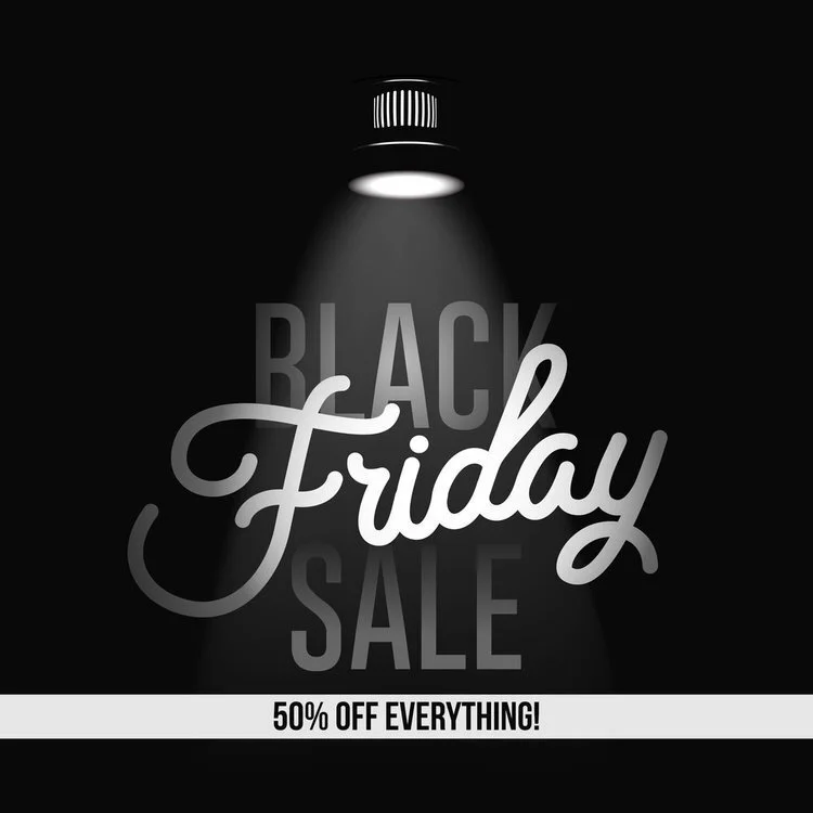 Black Friday sale advertisement with a spotlight effect, showing the words 'Black Friday Sale' and a banner that reads '50% off everything!'