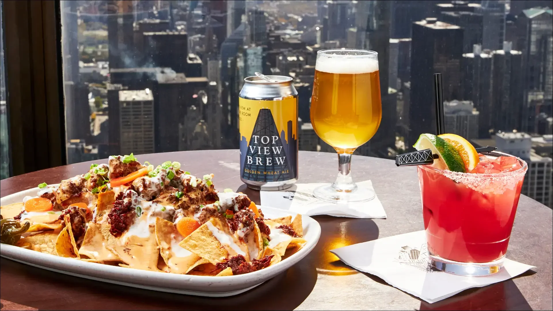Top View Brew beer, cocktail, and nachos overlooking Chicago.