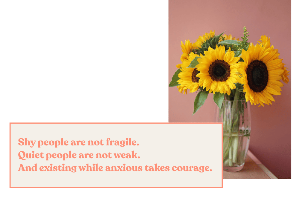 A vase of bright yellow sunflowers against a warm terracotta wall, vibrant and uplifting. Text overlay: “Shy people are not fragile, quiet people are not weak, and existing while anxious takes courage.”