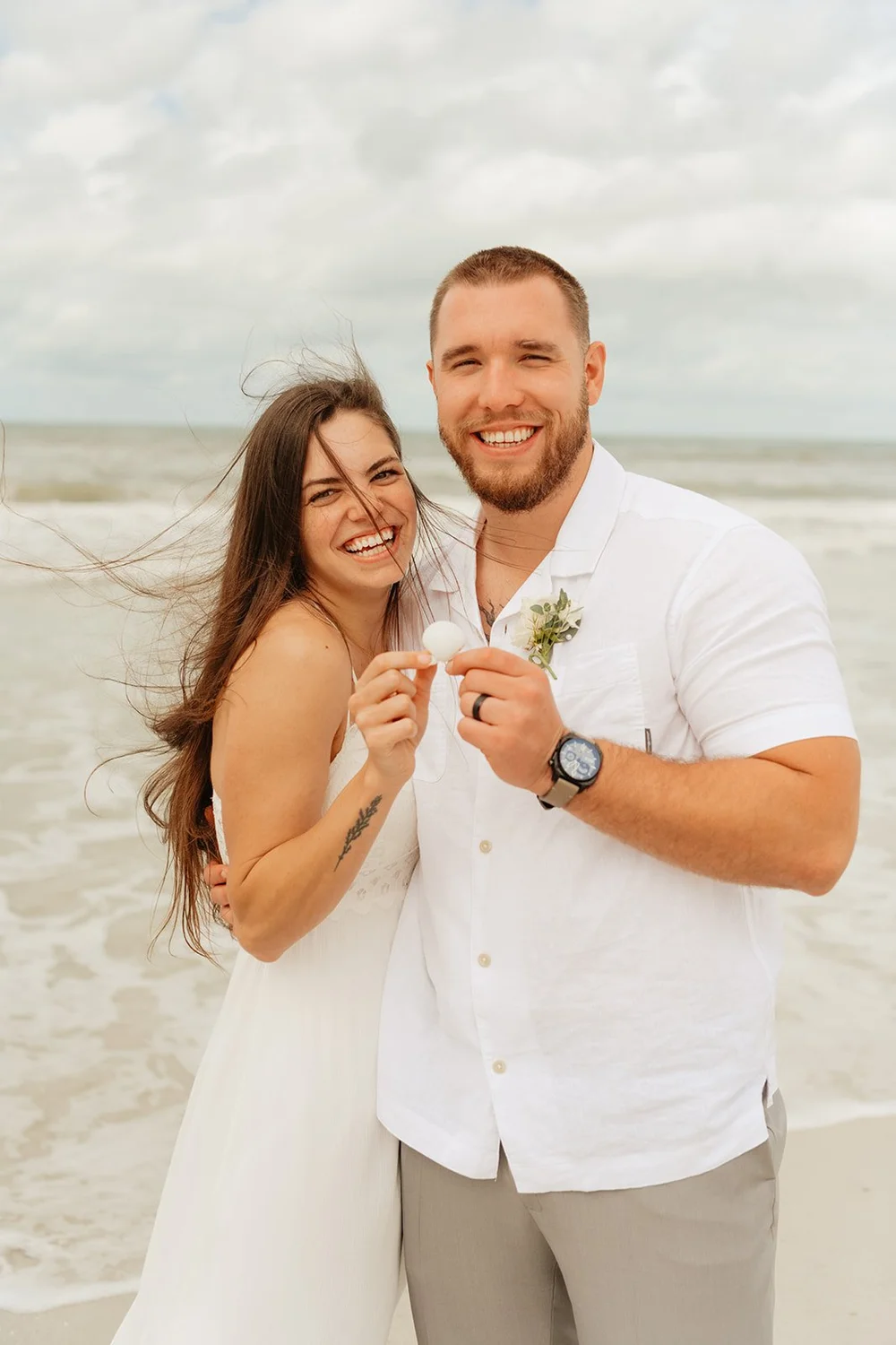 couple embraces at Florida elopement on beach