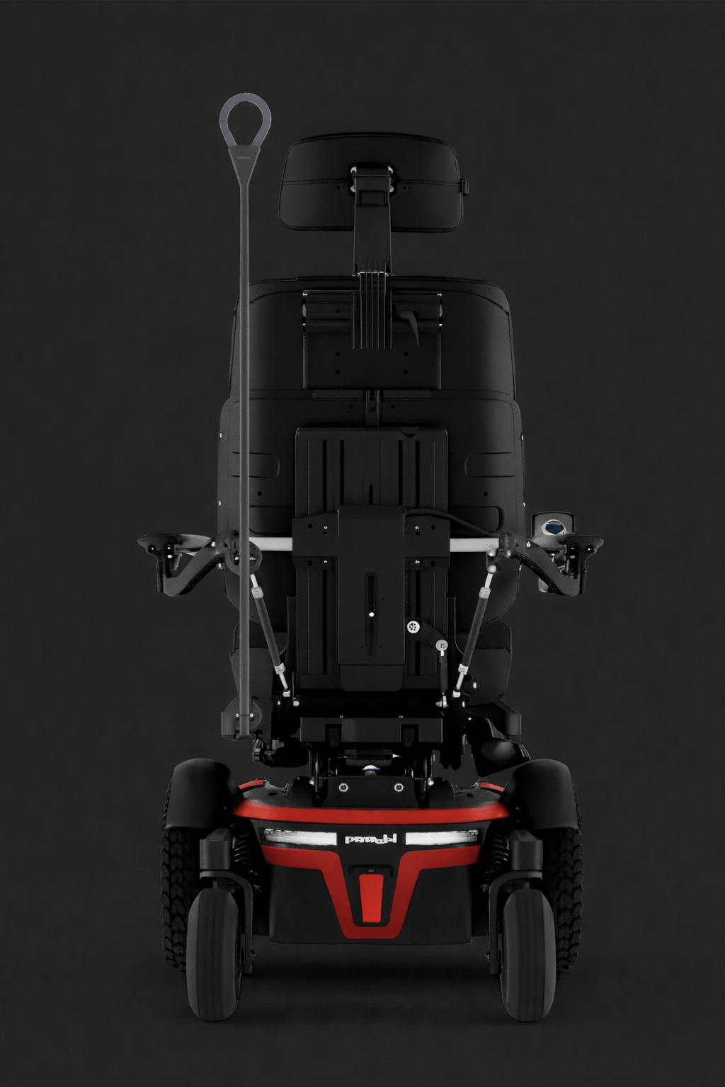 Electric wheelchair with black and red frame, large rear wheels, and a tall, adjustable headrest against a dark background with an attachable light.