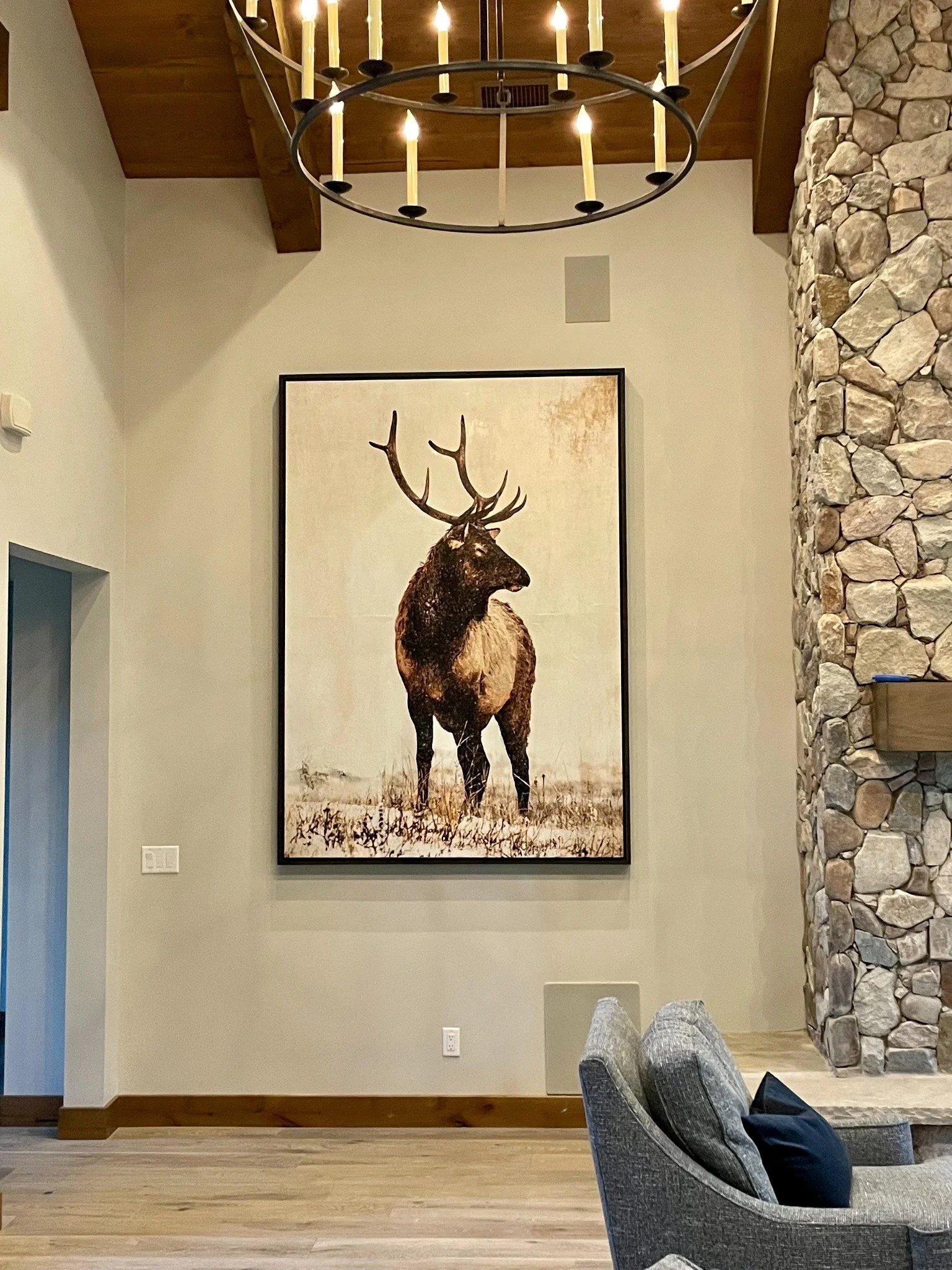 Large-scale Brandon Luther elk artwork installed in a luxury residence.