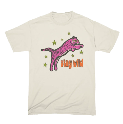 A white T-shirt featuring a pink tiger jumping with green stars around it and the text 'stay wild' in orange.