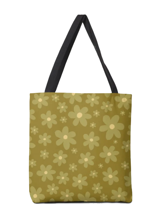 A tote bag with yellow and beige floral pattern and black handles.