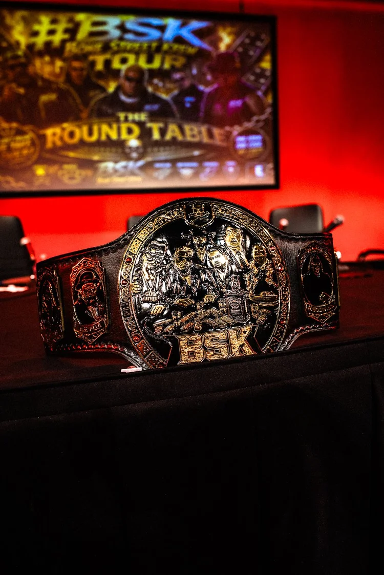 The BSK championship belt on stage under the Round Table screen