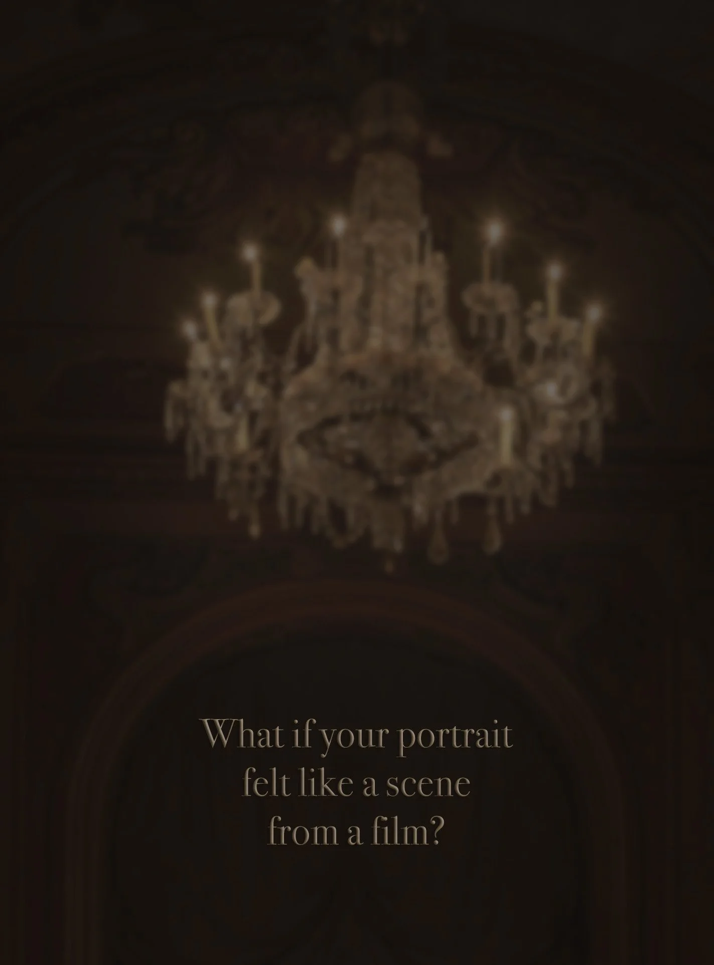 Crystal chandelier in a dark, cinematic interior with the words ‘What if your portrait felt like a scene from a film?