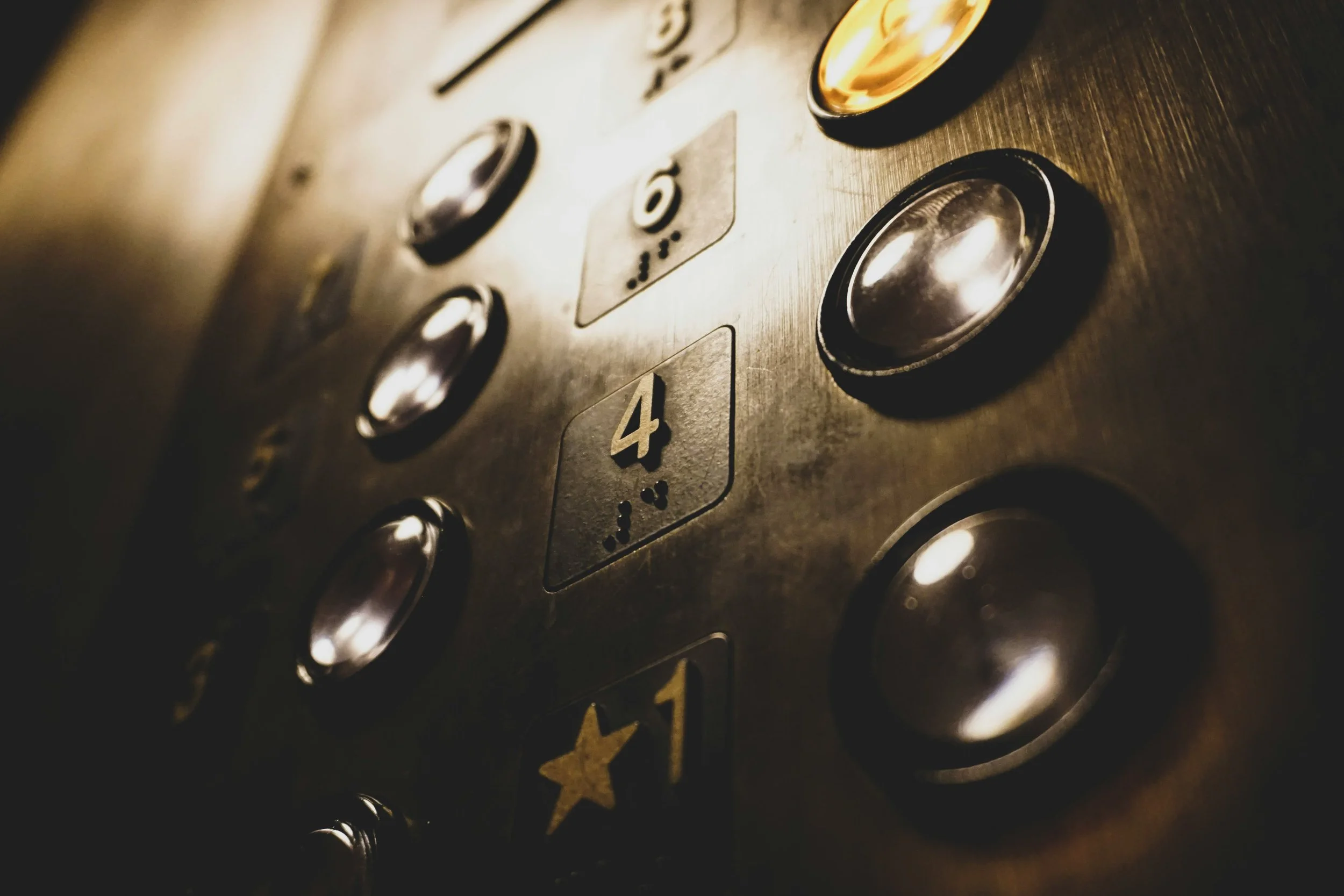 https://unsplash.com/photos/close-up-photo-of-elevator-push-buttons-YXZM_NSGf90