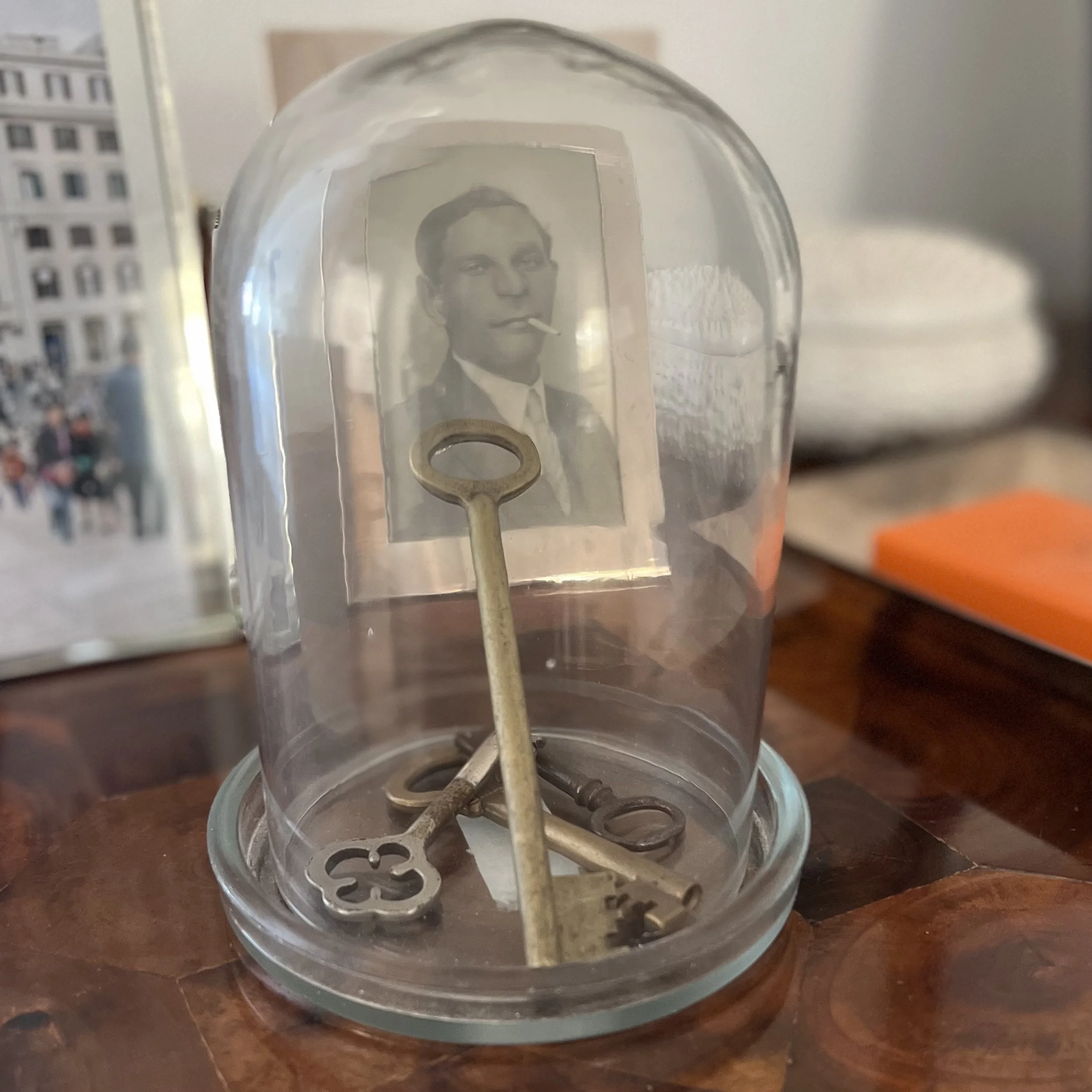 Vintage keys in a glass cloche.jpeg