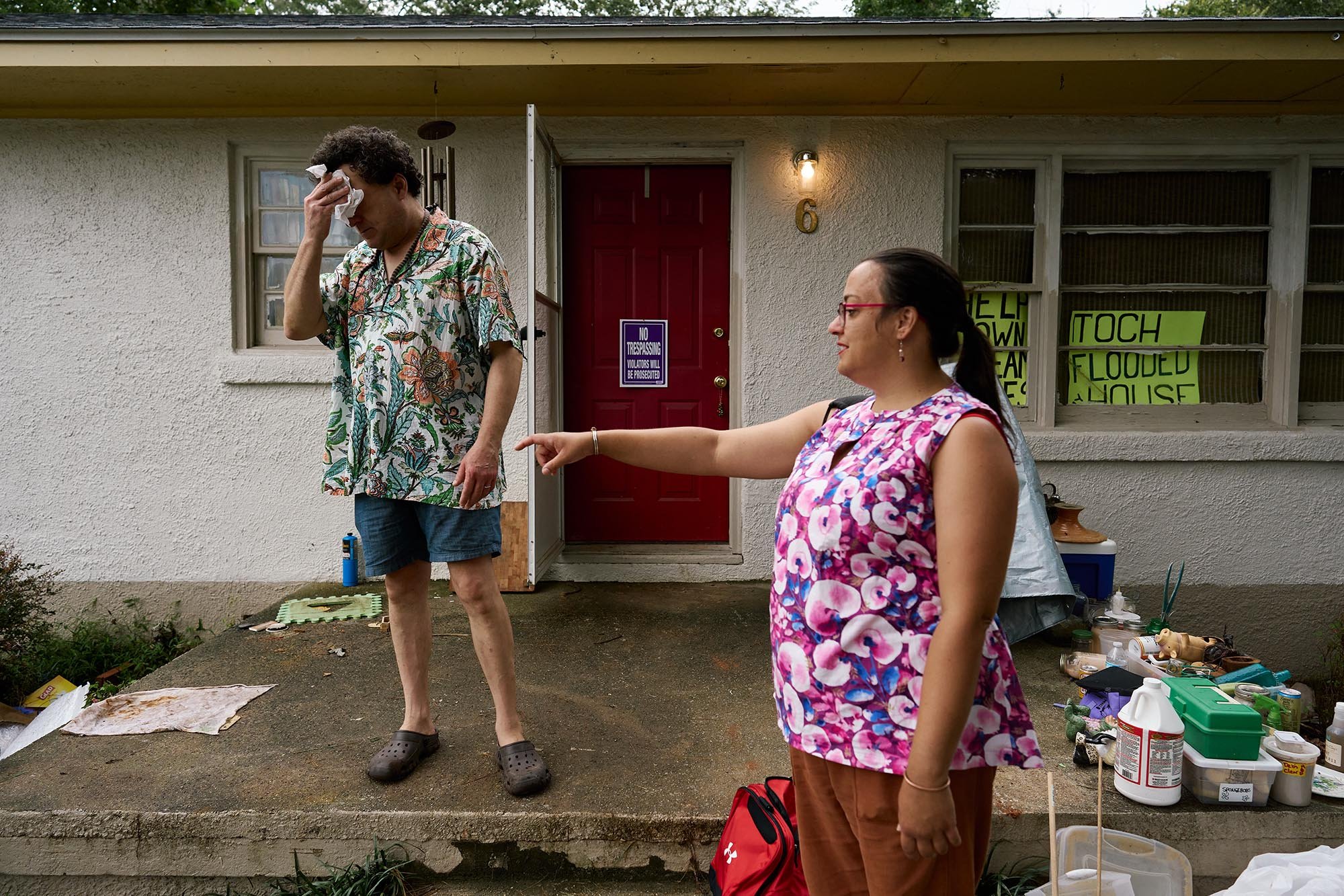 Paul Greganti (left) and Lou Horton work on cleaning out their flooded home in Chapel Hill, NC 2 weeks after Tropical Flood Chantal caused widespread flooding in the state. (for INDY Week)