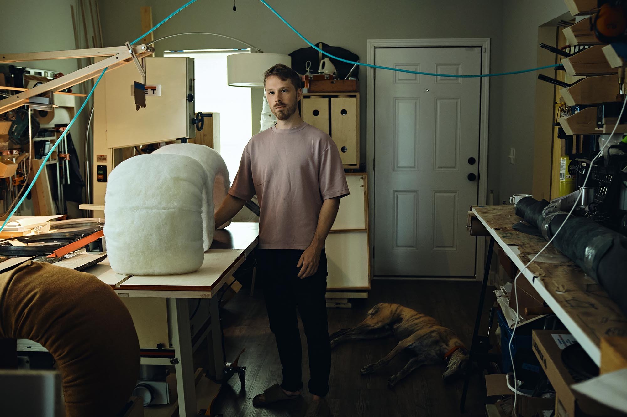 John used his city's first time home buyer program to buy a small home in downtown. He converted part of his home into a workshop.