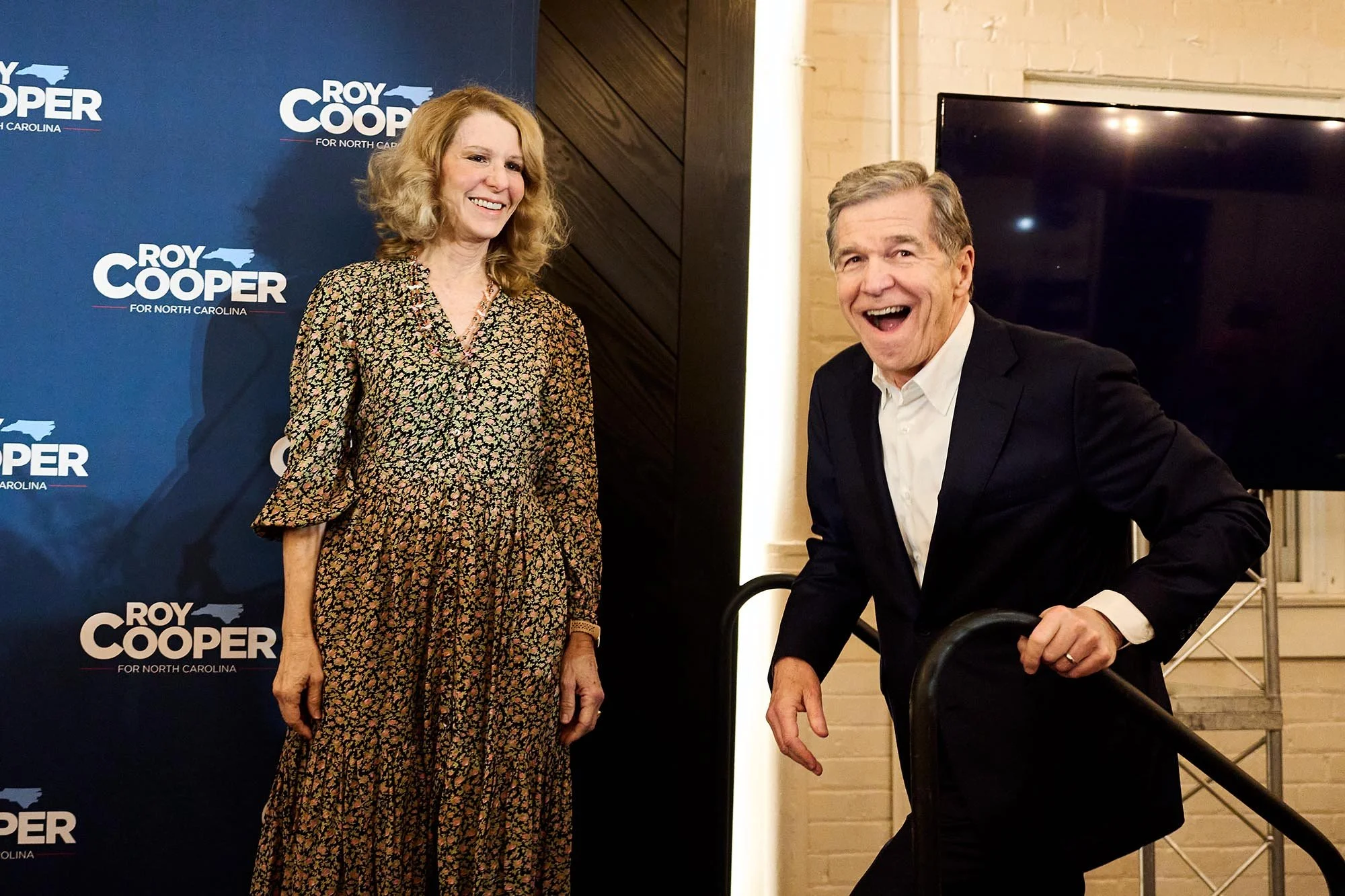 Former NC Governor Roy Cooper takes the stage with his wife, Kristin, to accept the Democratic nomination for US Senate after winning his primary race. (for AP)