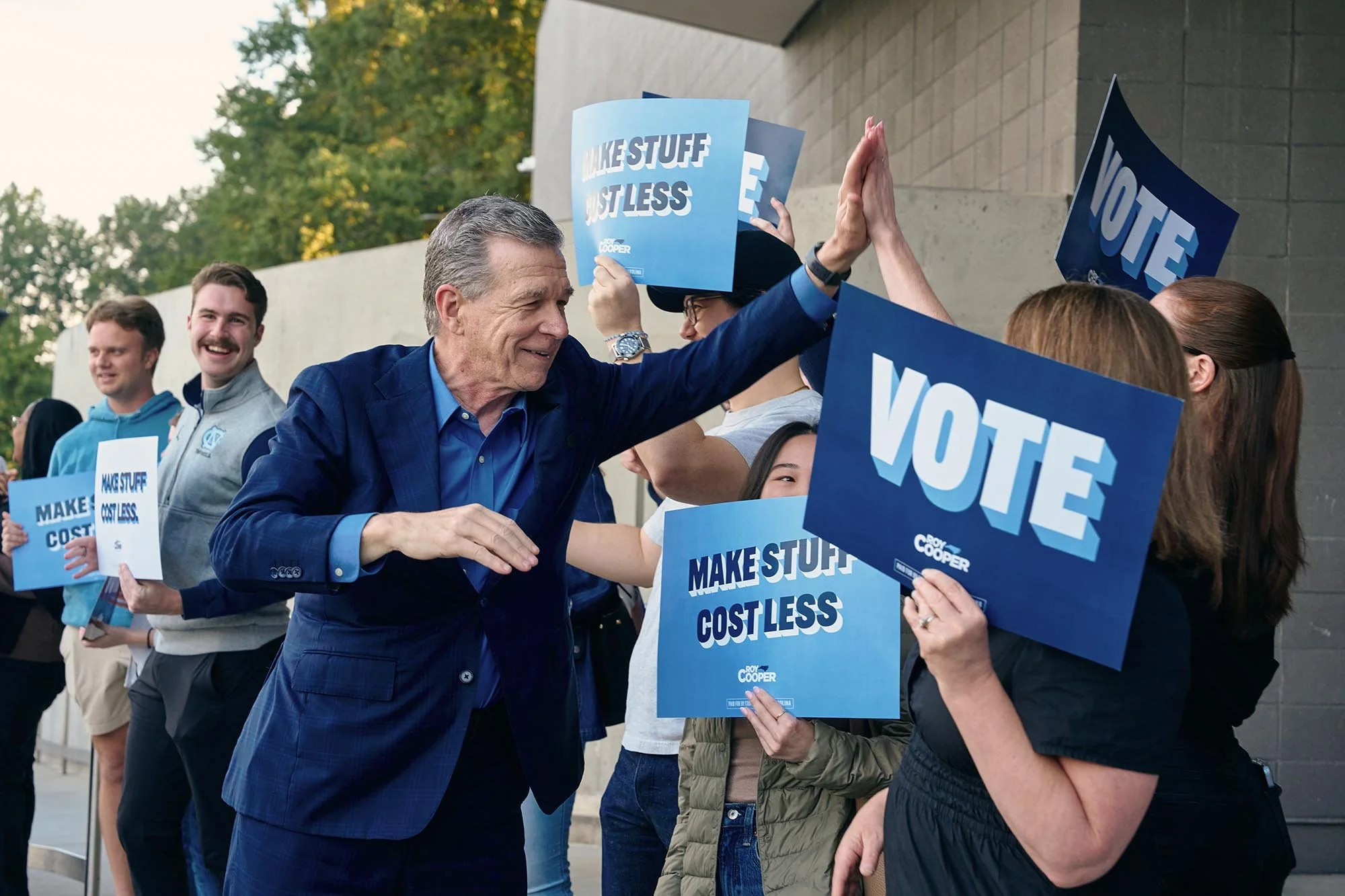 Roy Cooper, Democratic candidate for US Senate, greets supporters before voting on the first day of early voting in NC. (for AFP)