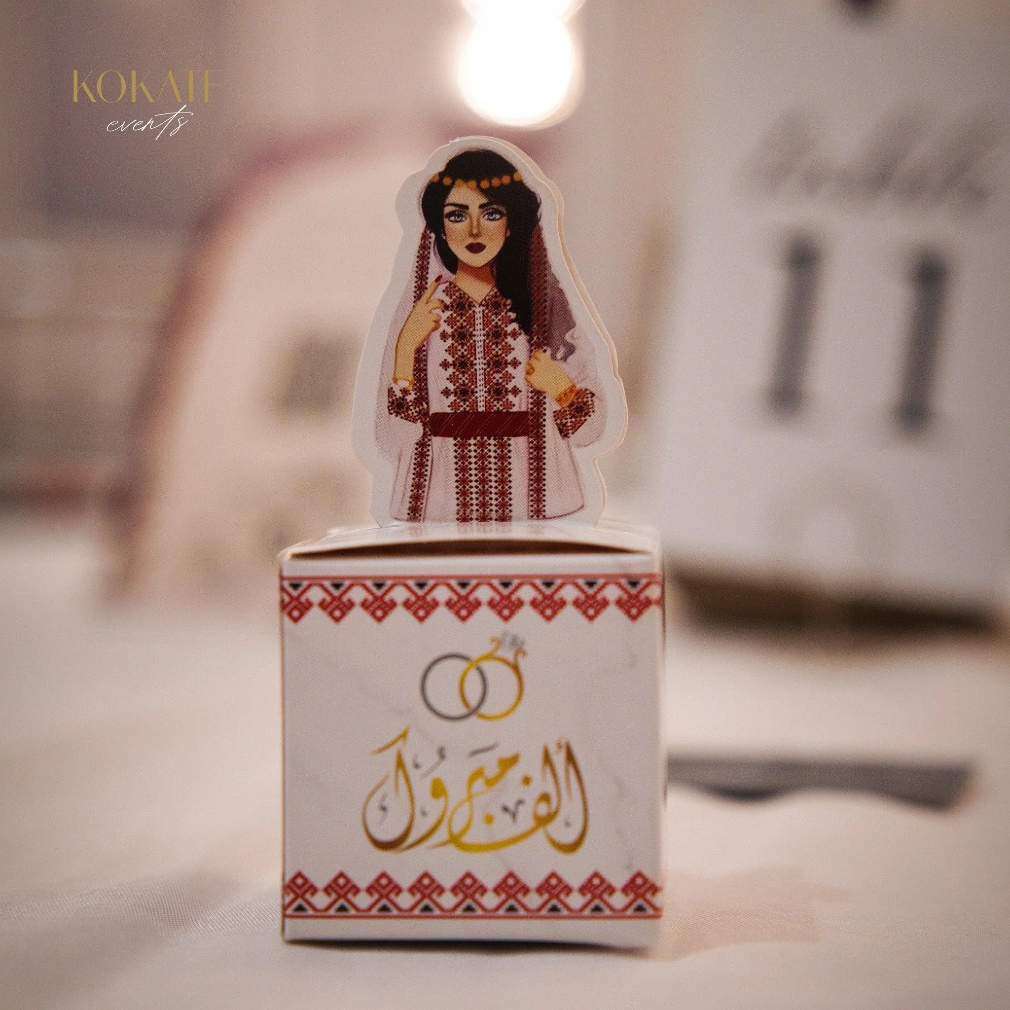 ✨ Our Wedding Favor Box ✨

We take care of every detail to make your celebration truly unforgettable. 💛 This charming cube holds sweet treats 🍫🍬 and features elegant red &amp; white embroidery patterns.

The Arabic calligraphy "ألف مبروك&quot