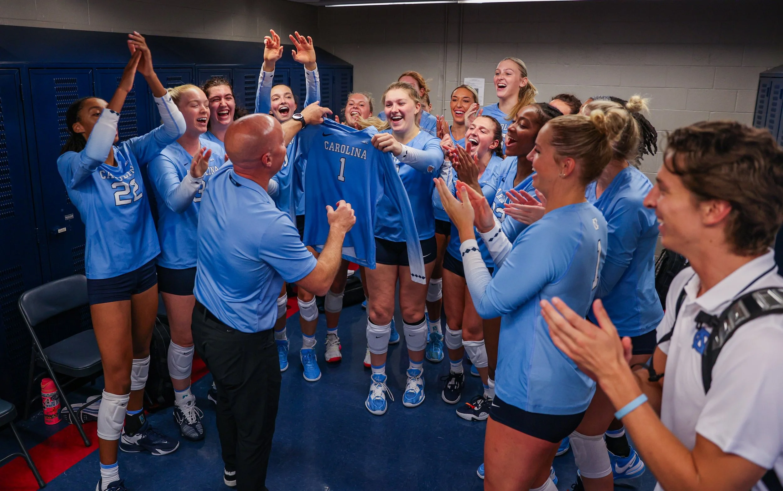 The University of North Carolina teams gathers to celebrate head coach, Mike Schall's first win as head coach. Marison freelanced for UNC Volleyball when they visited Tucson to play against the University of Arizona.