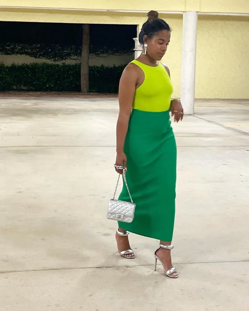 Chanel Tyler wearing a green skirt