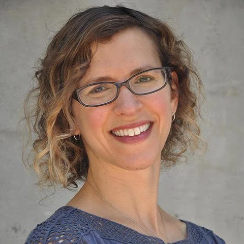 Headshot of woman with glasses
