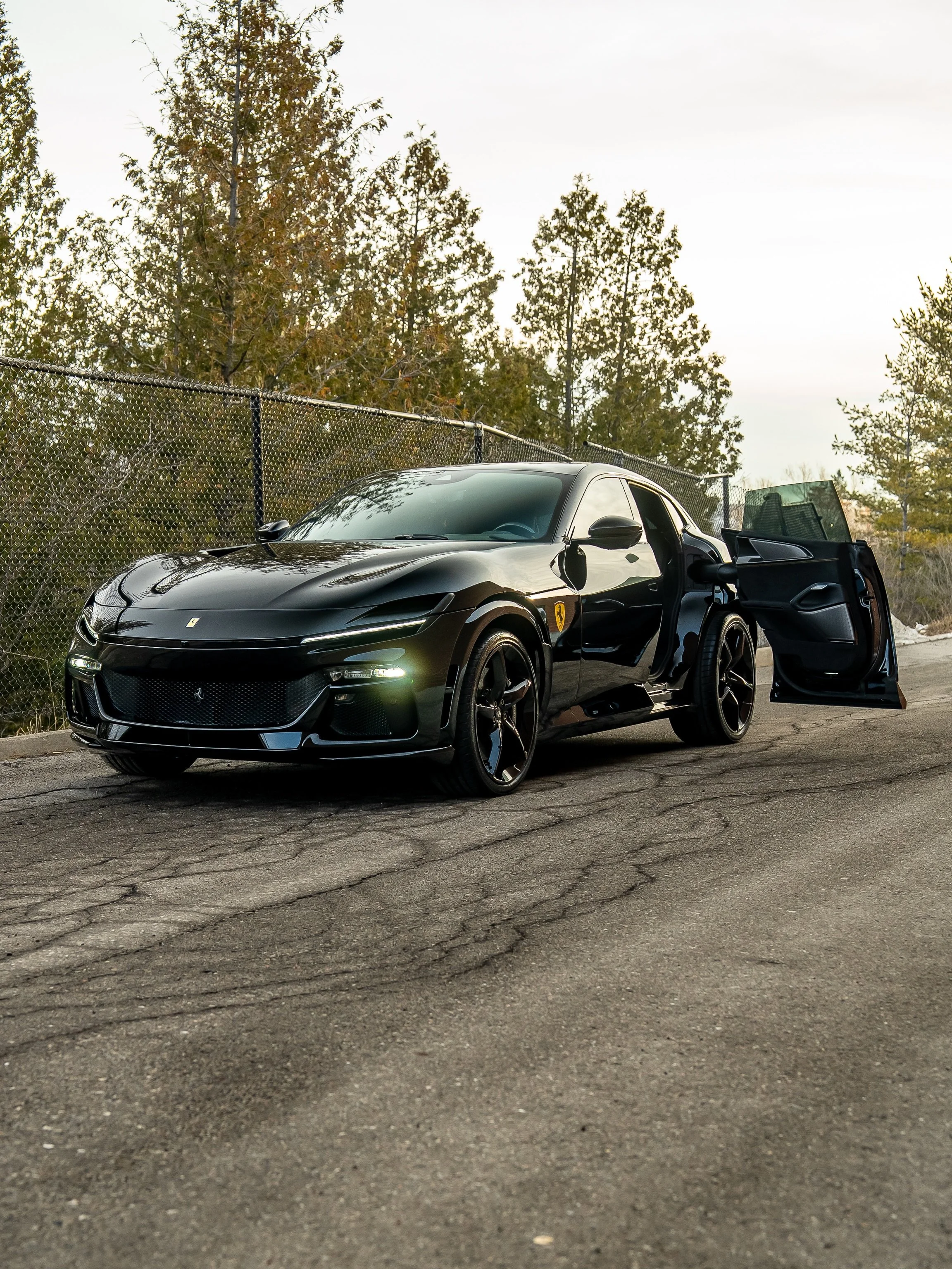 If Batman wanted an SUV, this Ferrari Purosangue would be it 🔥 Murdered out spec with yellow accents throughout, including our personal favourite painted shields option. This gloss black paint is looking deeper than ever thanks to a full suit of cus