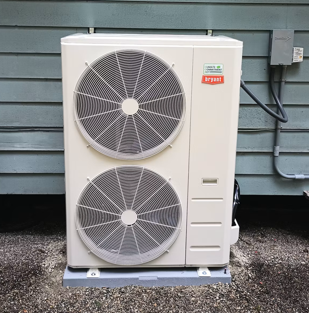 Pictured is the outdoor unit of a heat pump system.