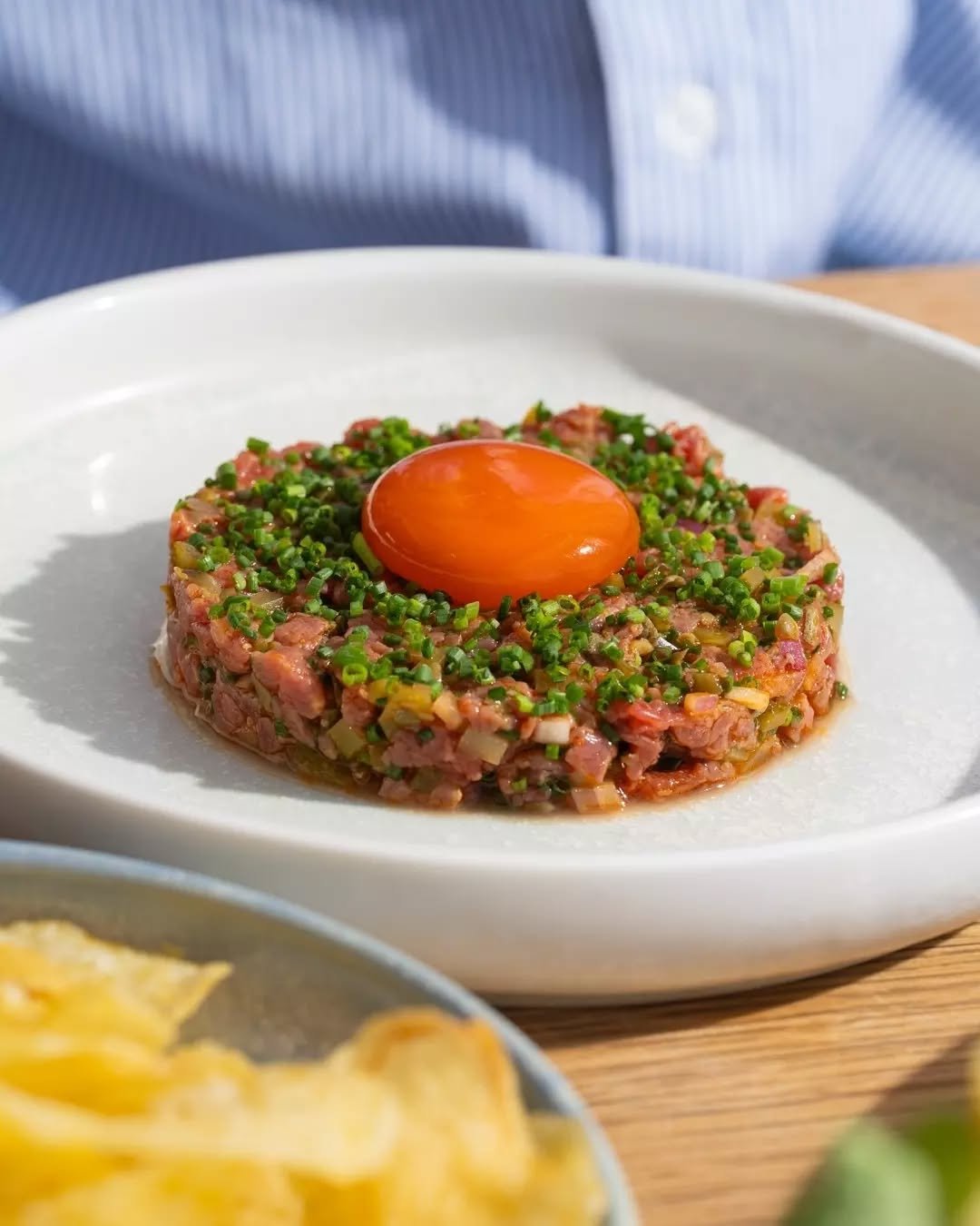 NEW // Wagyu Beef Tartare with cornichons, chives, cured egg yolk, potato crisps 🤝