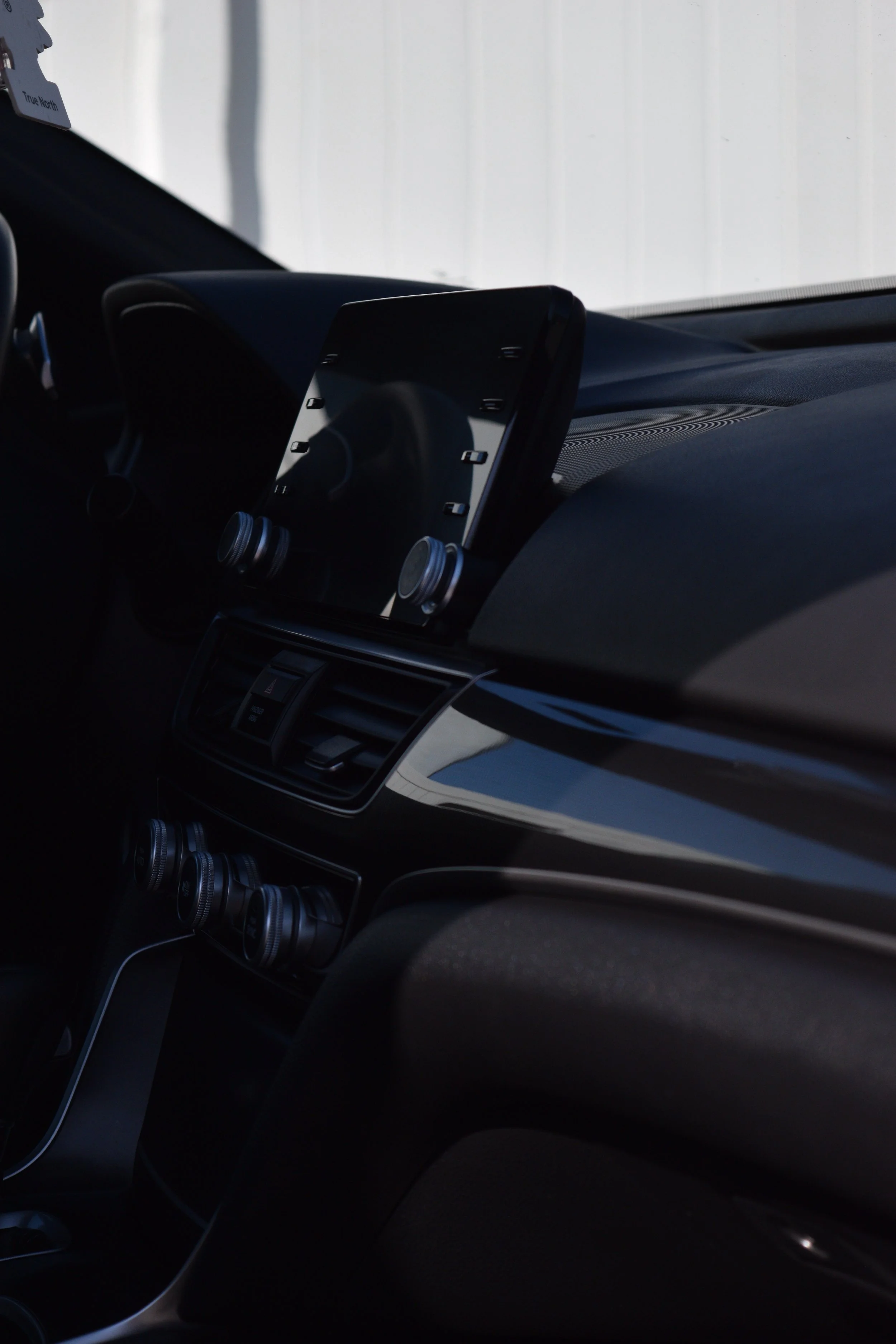 Interior Complete Detail infotainment console in Eagle Mountain, UT.  meticulously dusting all cracks and crevices with an air blaster and soft horse hair brush. Followed with a thorough cleaning with our shine supply solution diluted 4:1 for a perfe