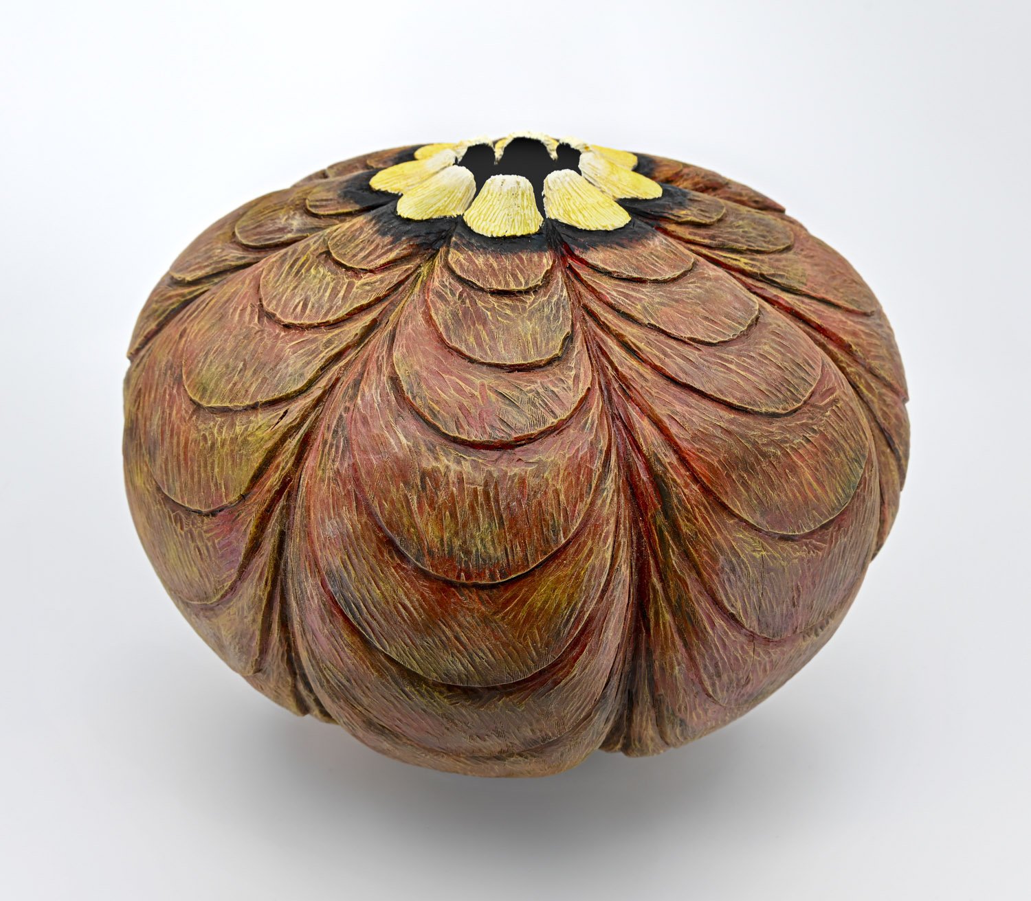 Burnt sienna, black and yellow colored FEED ME ~ Cherry Vase  Turned wood, carved and textured with pyrography, painted with acrylics. Dimensions: 8"h x 10"w