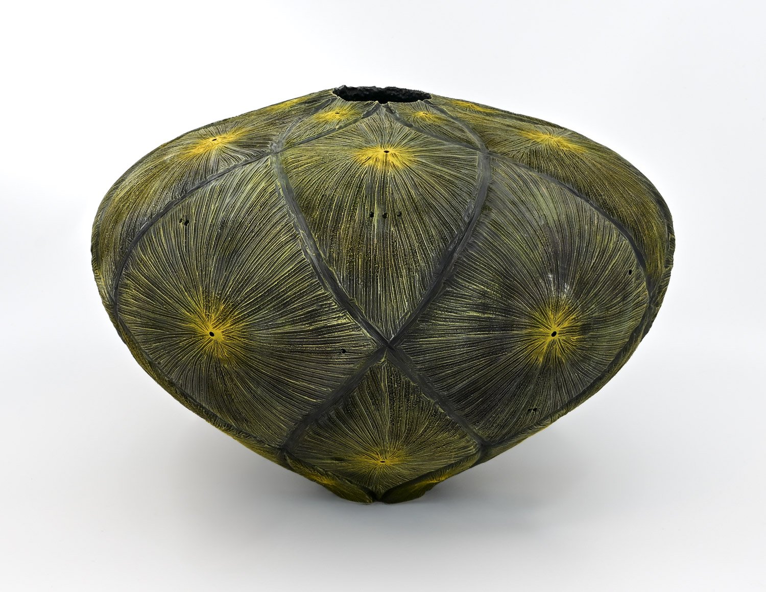 sunshine yellow and dark green to black colored SUNSPOTS ~ Maple Vase  Turned wood, carved and textured with pyrography, painted with acrylics. Dimensions: 6.5"h x 10"w