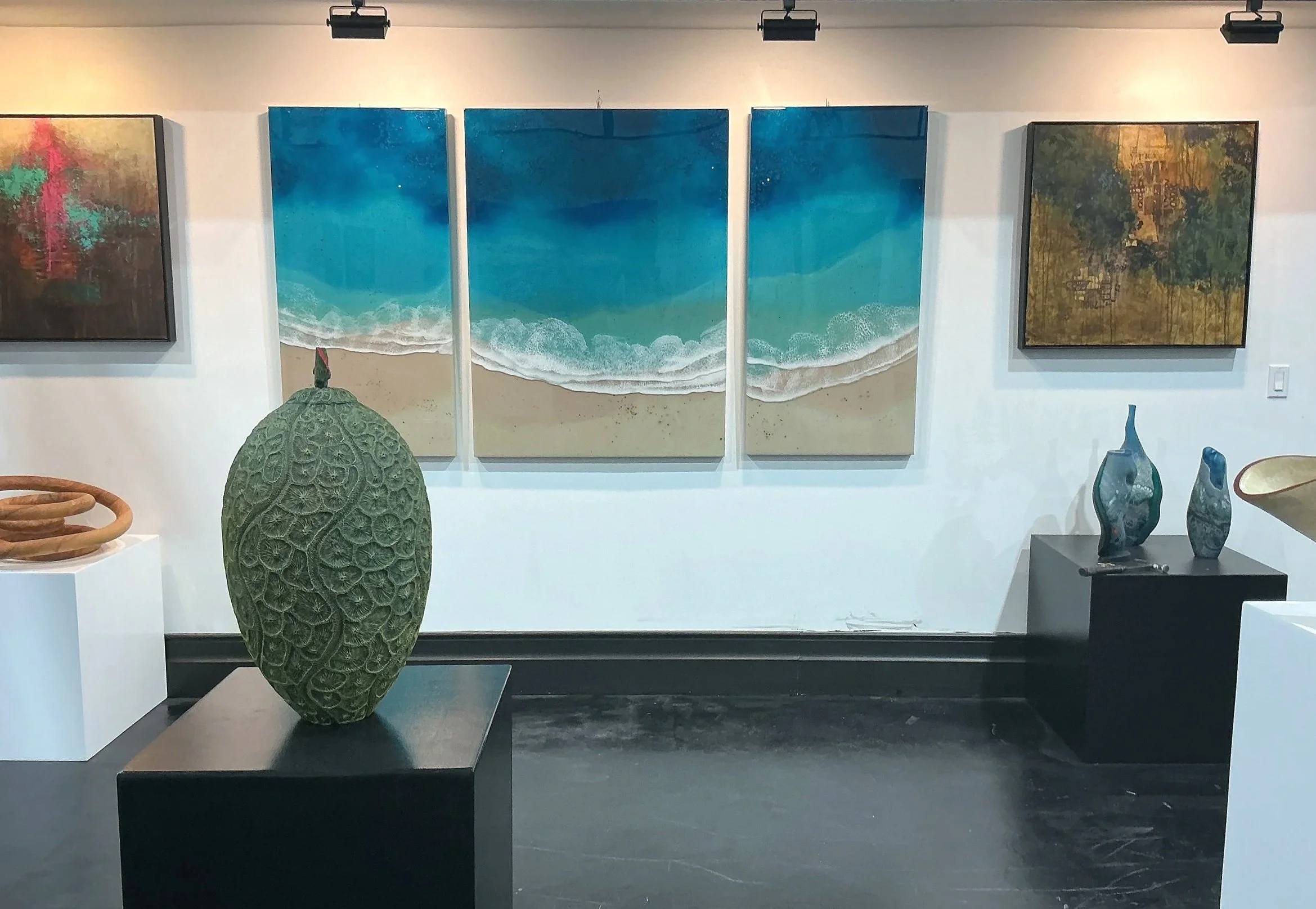 Steve Miller carved wood coral vase with finial in the main gallery of the Bayshore Art Gallery in Naples, FL.