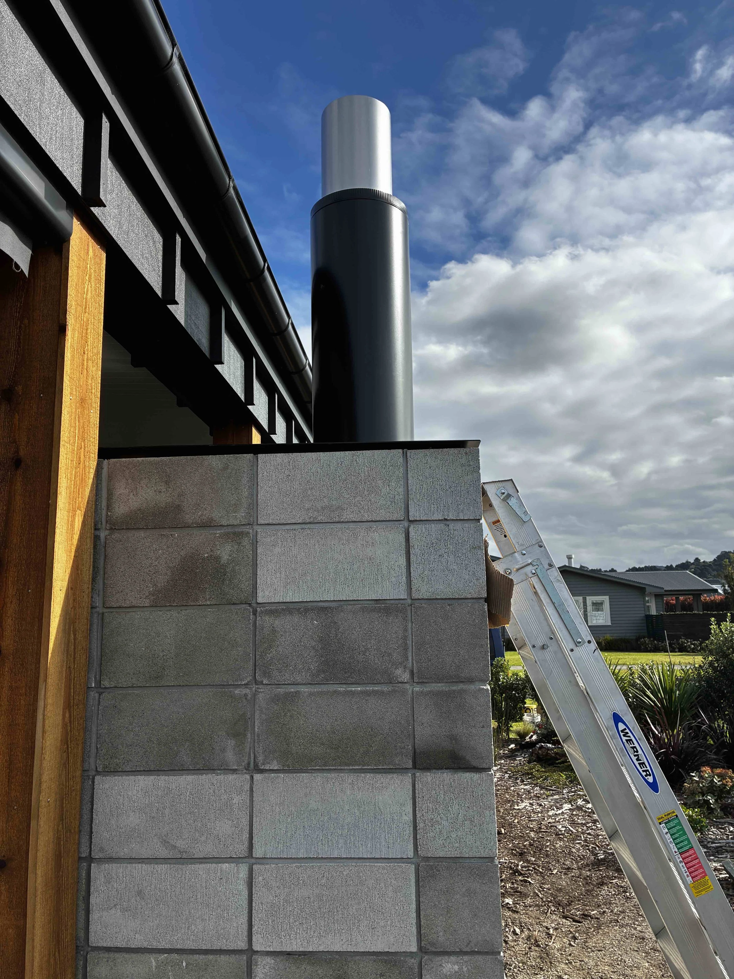 Concrete block work with black flue