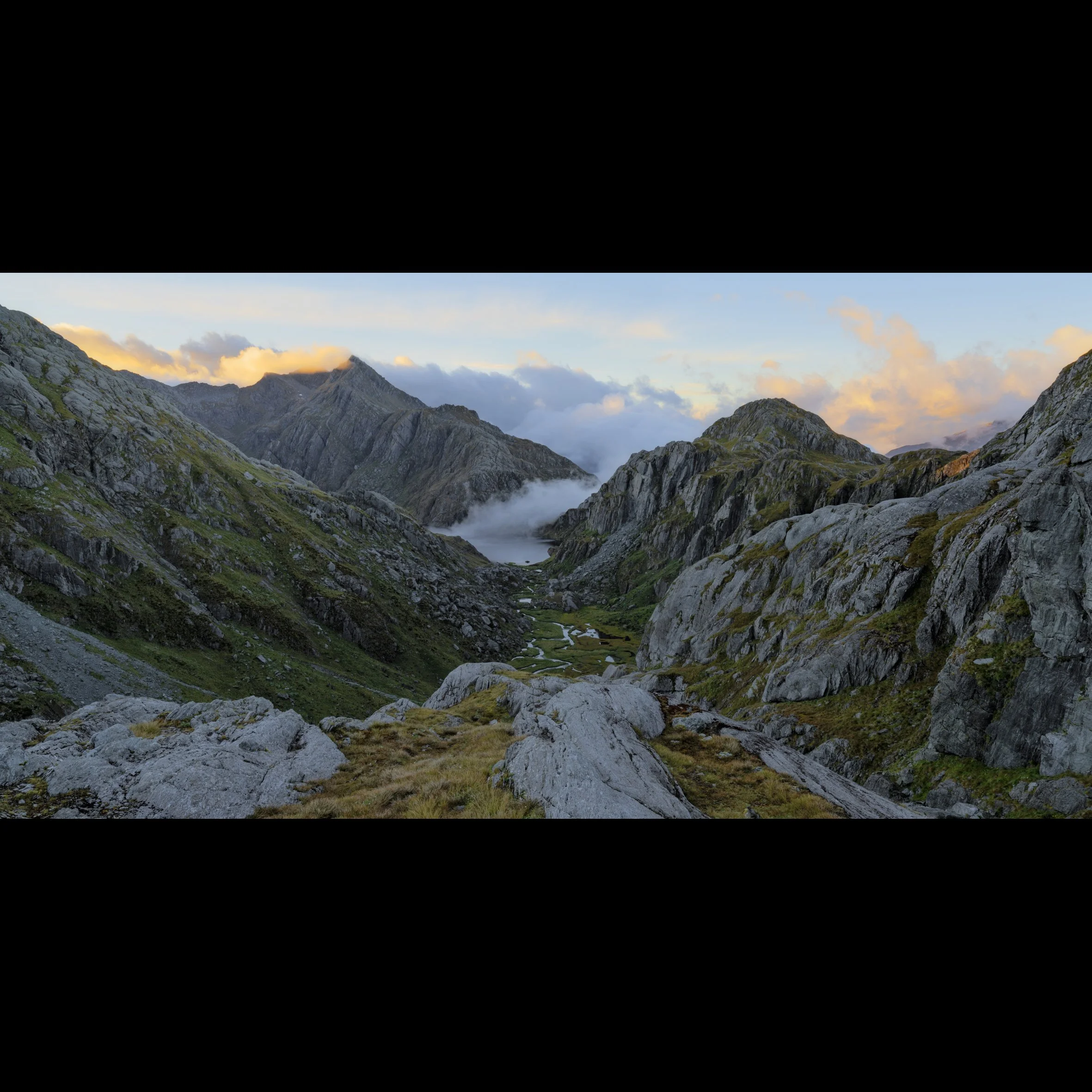 Sunrise from Lake Wilson looking down onto the Valley of the Trolls and Harris Saddle on the Routeburn Track in Mt. Aspiring National Park