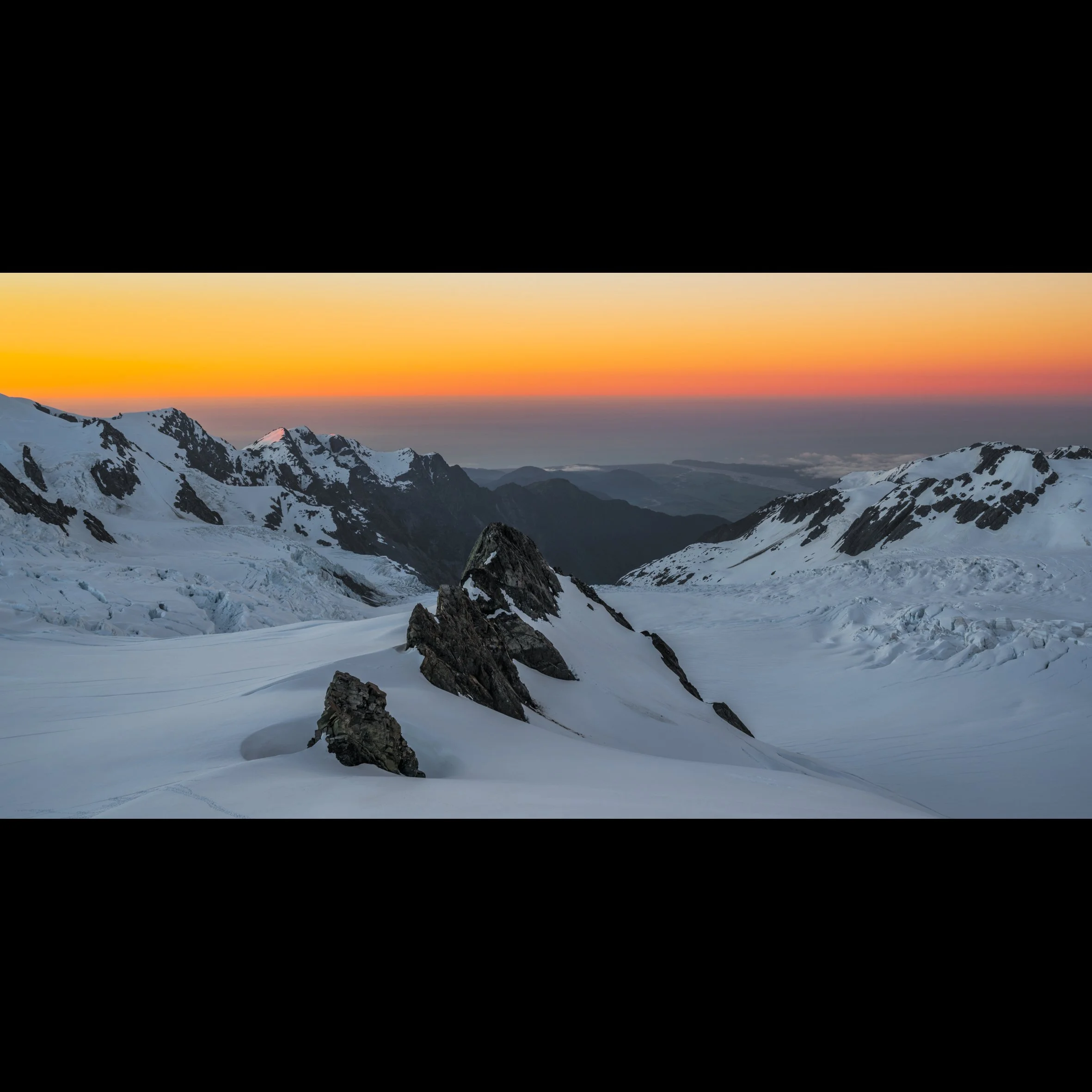 Sunset from the Centennial Hut overlooking the Tusk and the upper Franz Josef Glacier and the Tasman Sea.