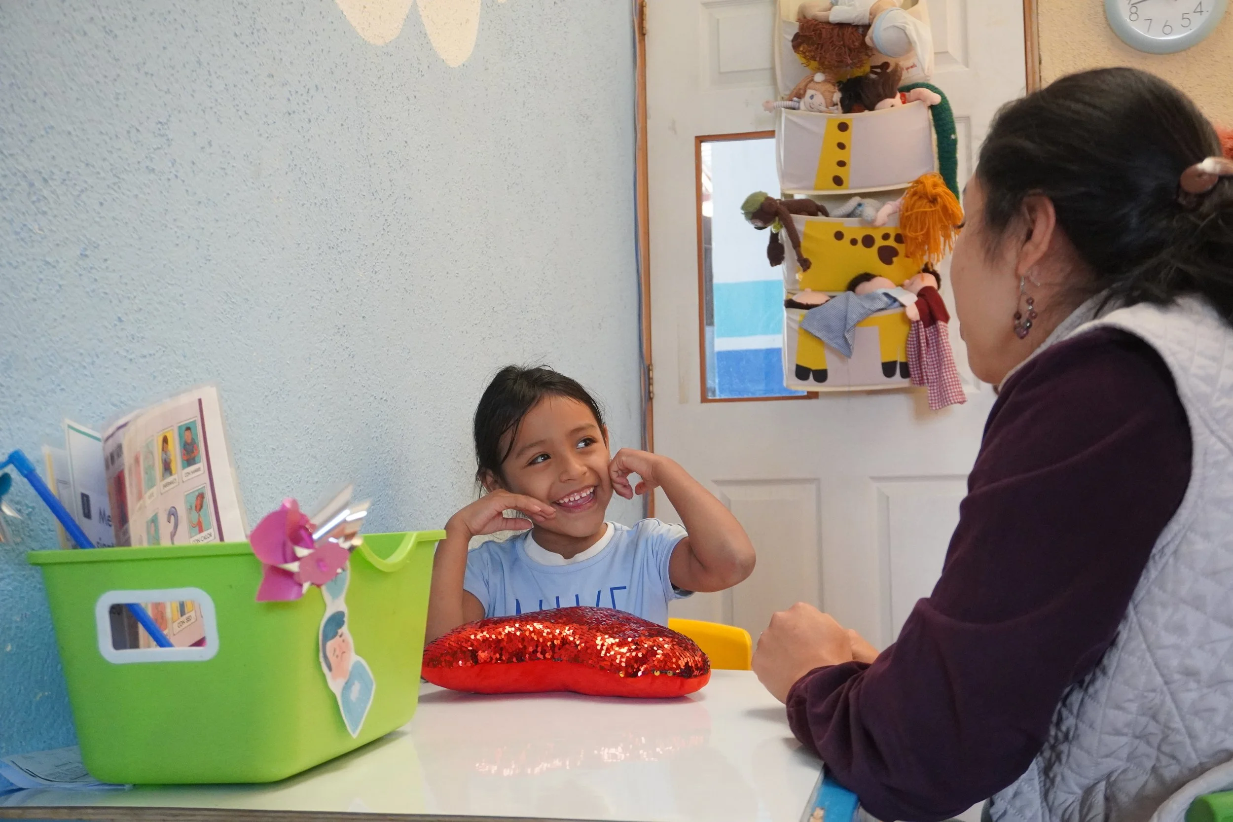 Psychologist Teacher With Child Student On Swing The School of Hope Guatemala