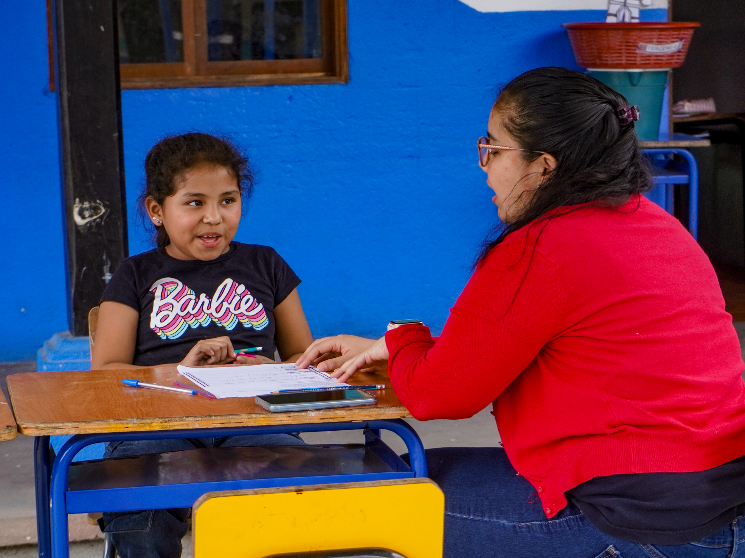 Teacher Helping Student Child At The School of Hope Guatemala