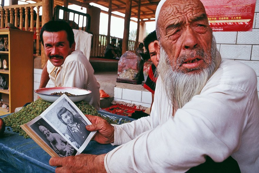  Villagers with Mildred’s book in Tuyoq, Taklamakan desert.  