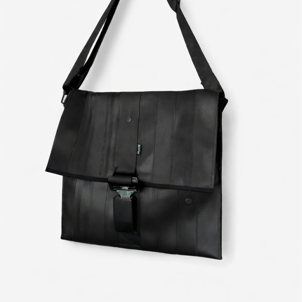 Upcycled seatbelt messenger bag with buckle closure and adjustable strap
