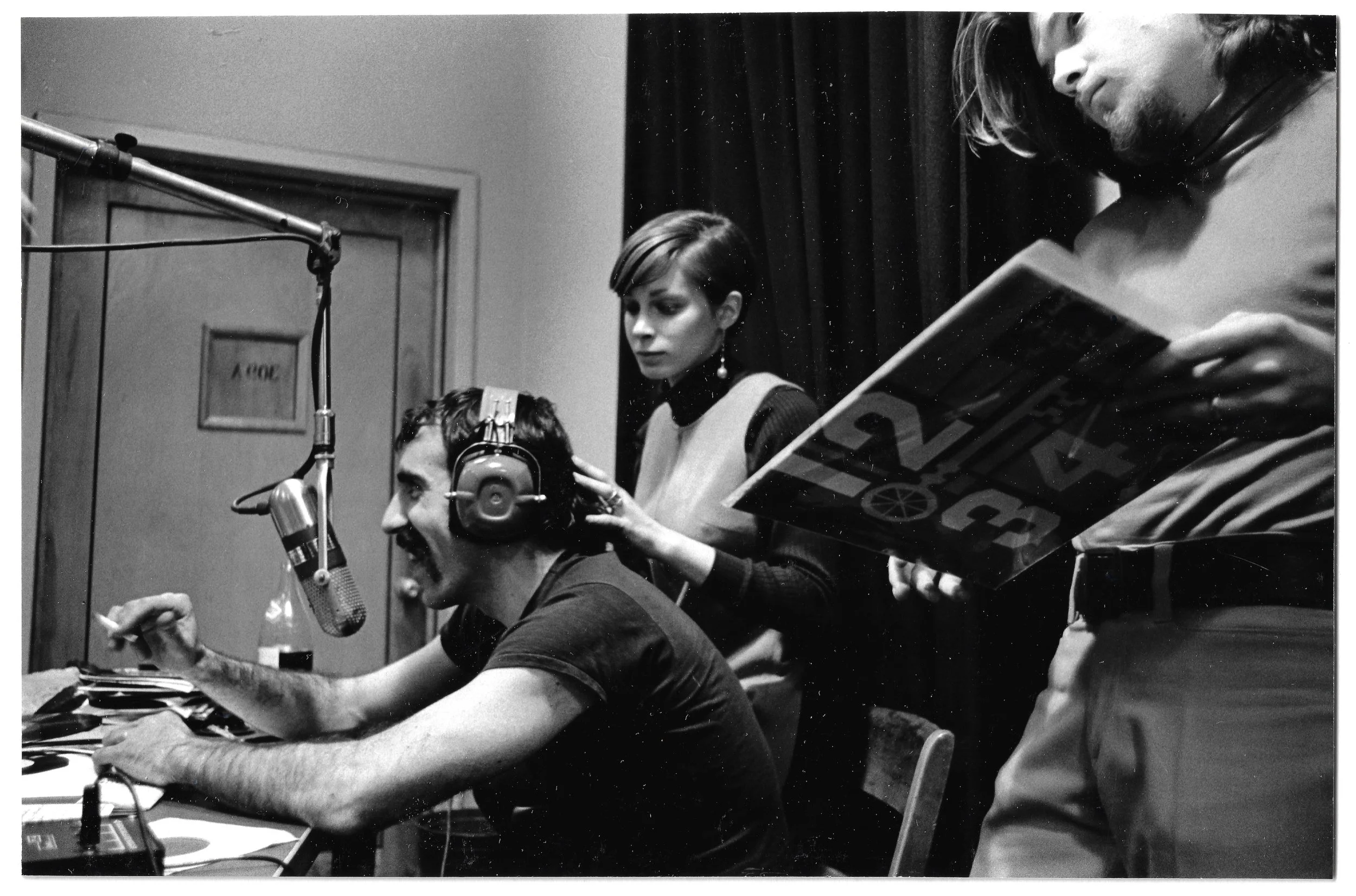 WBUR dj Uncle T at work with his staff