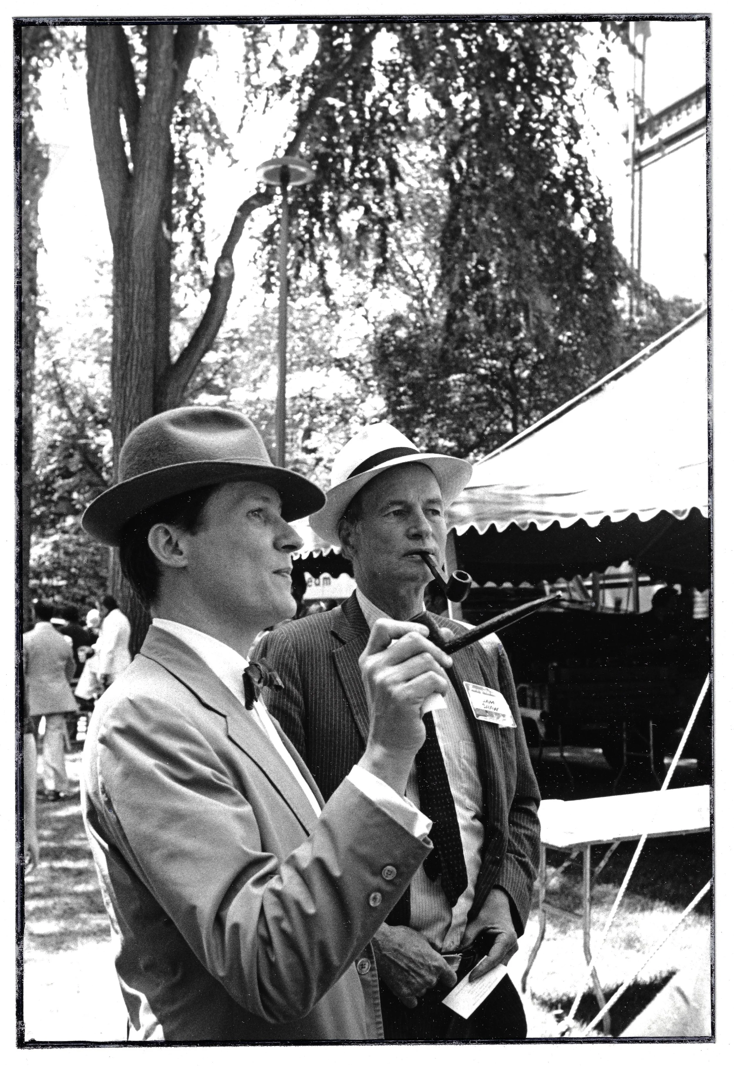 Pipesmoking grads in the yard on Commencement day.. 