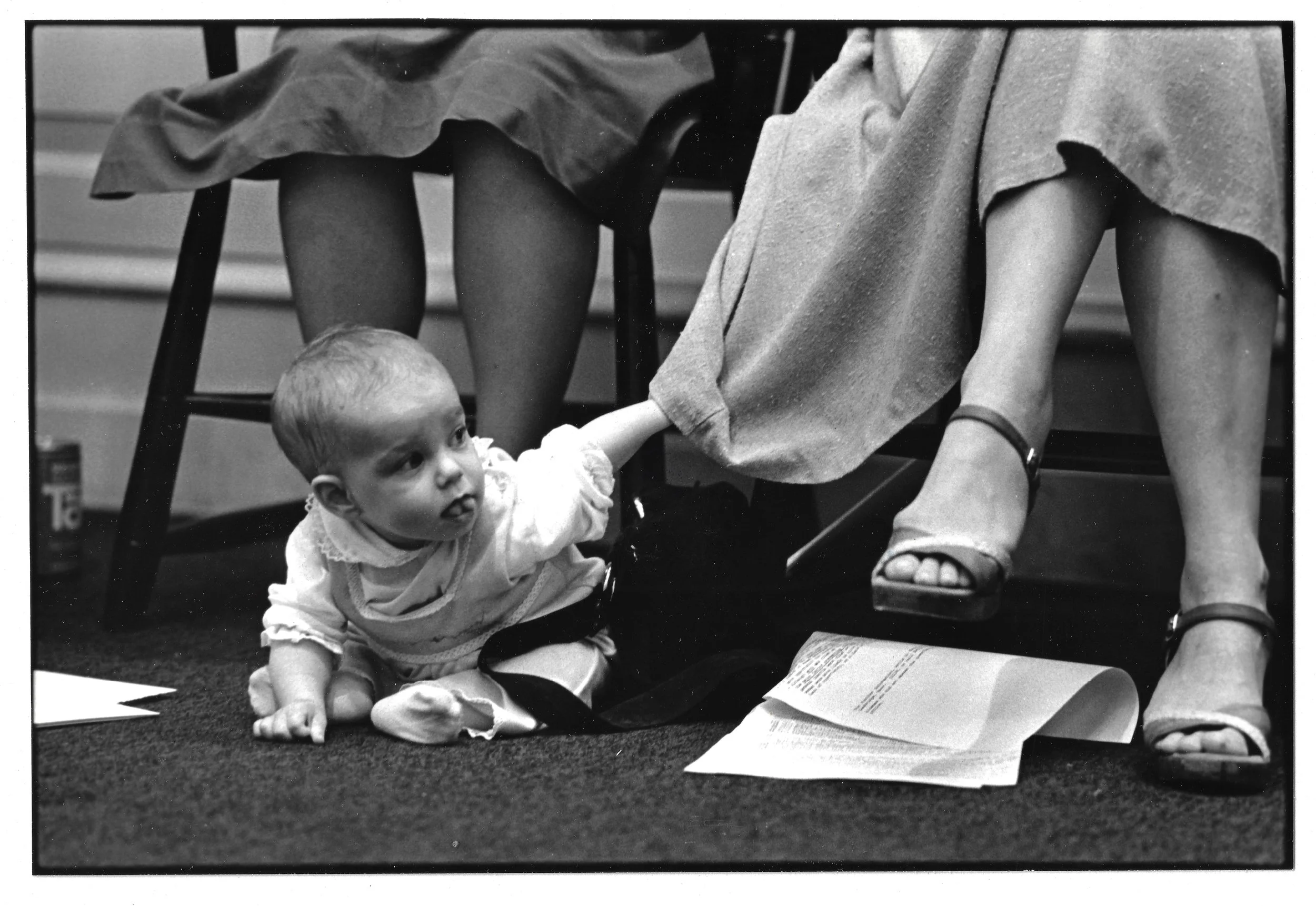 A Radcliffe panel with a very young participant peeking round her mother's skirts.