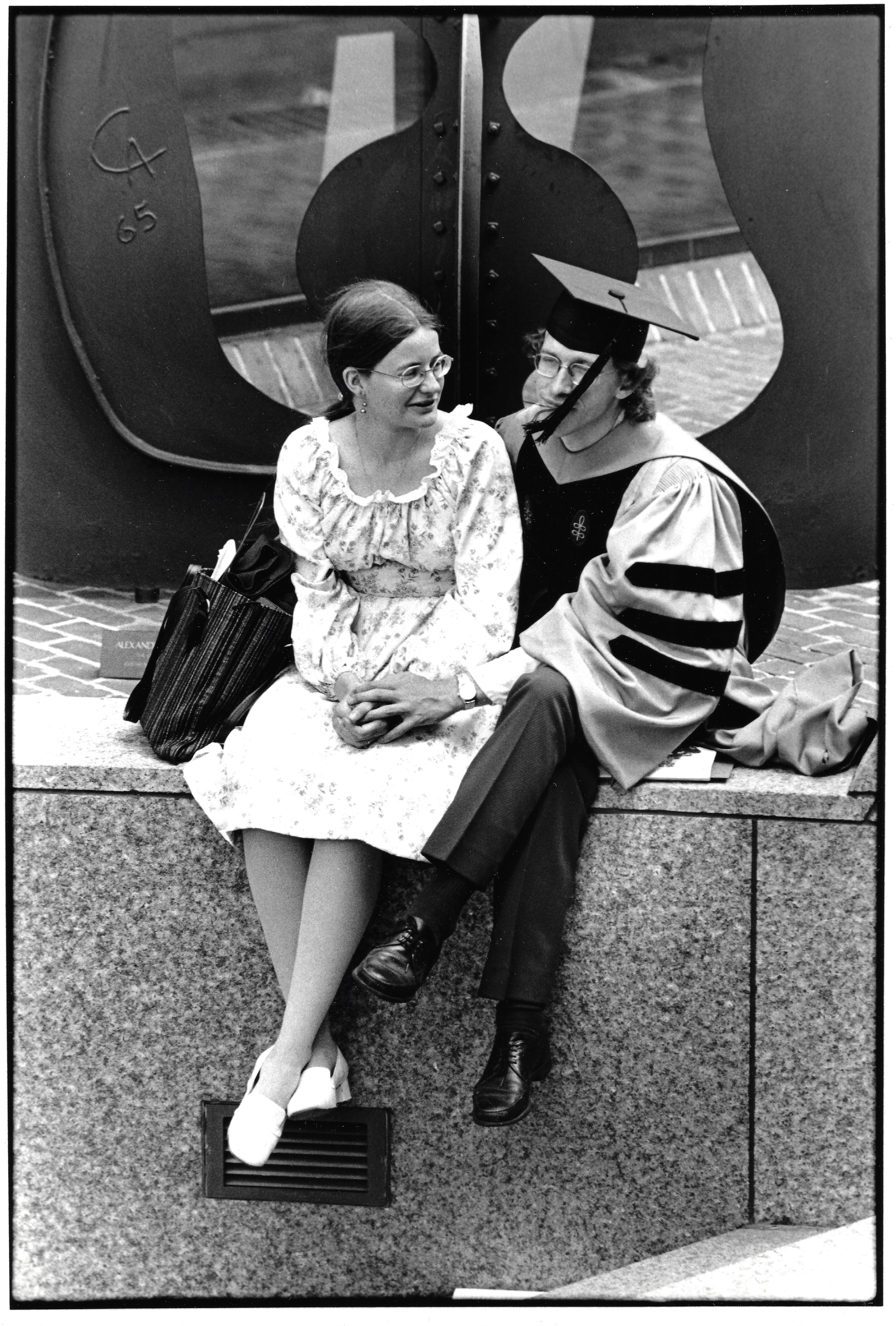 Grad and woman in Harvard Yard