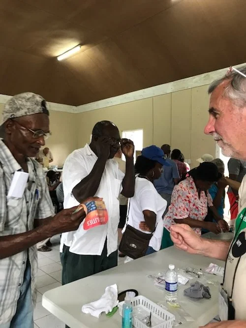 People picking up custom made glasses