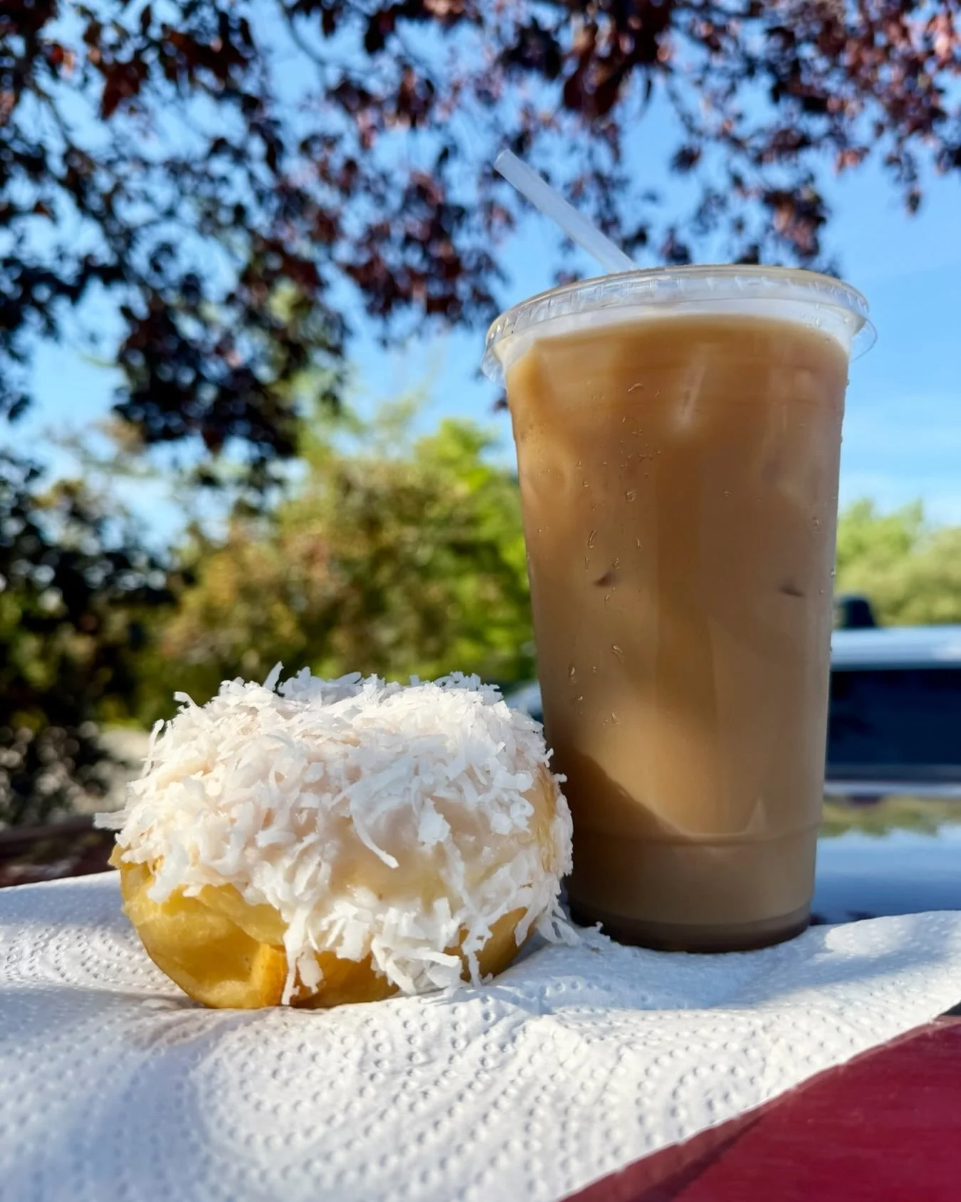 Soaking up the sun with an iced coffee and coconut donut from Willoughby&rsquo;s will jump start your day!