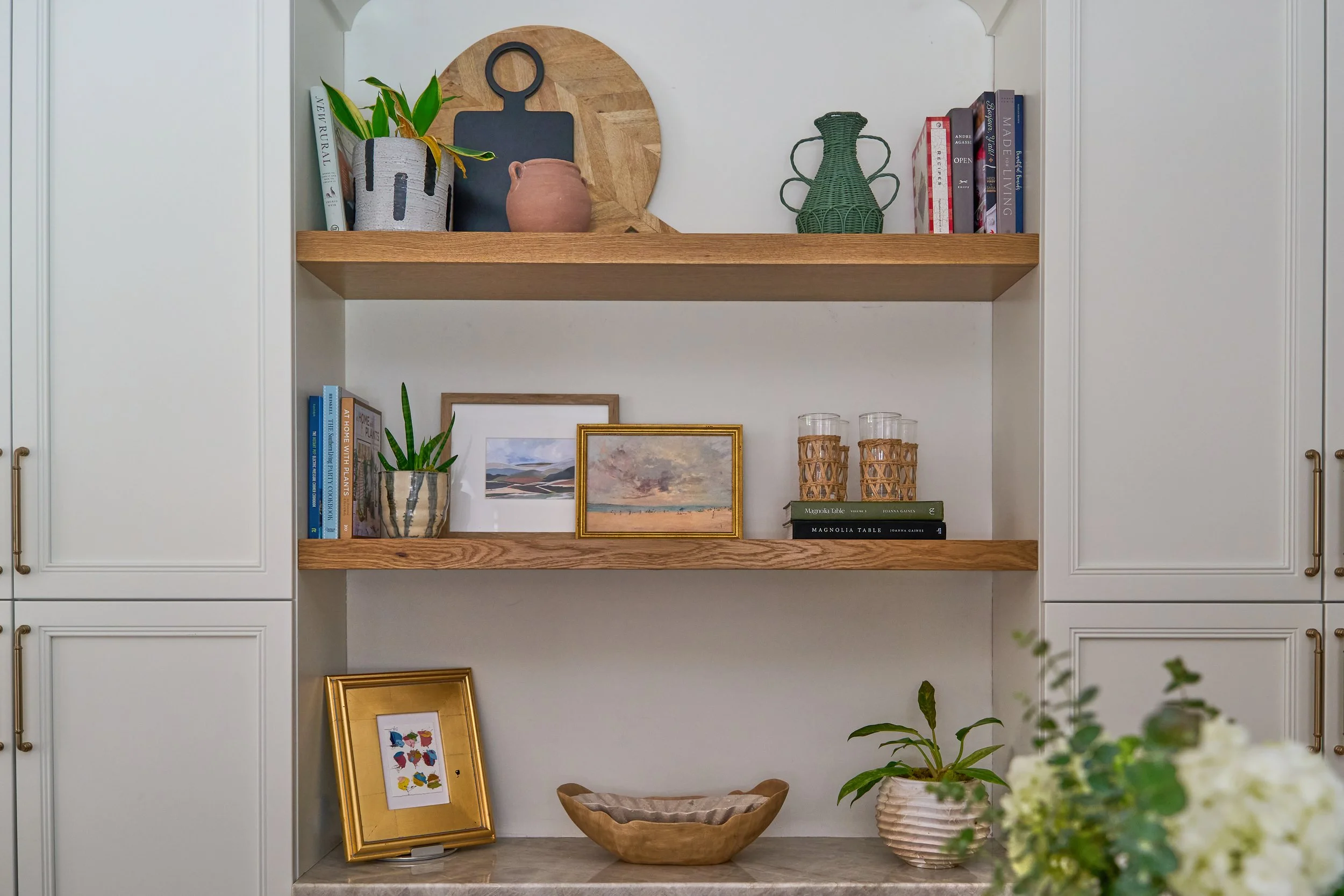 open shelving in kitchen styled in a natural, high end look.