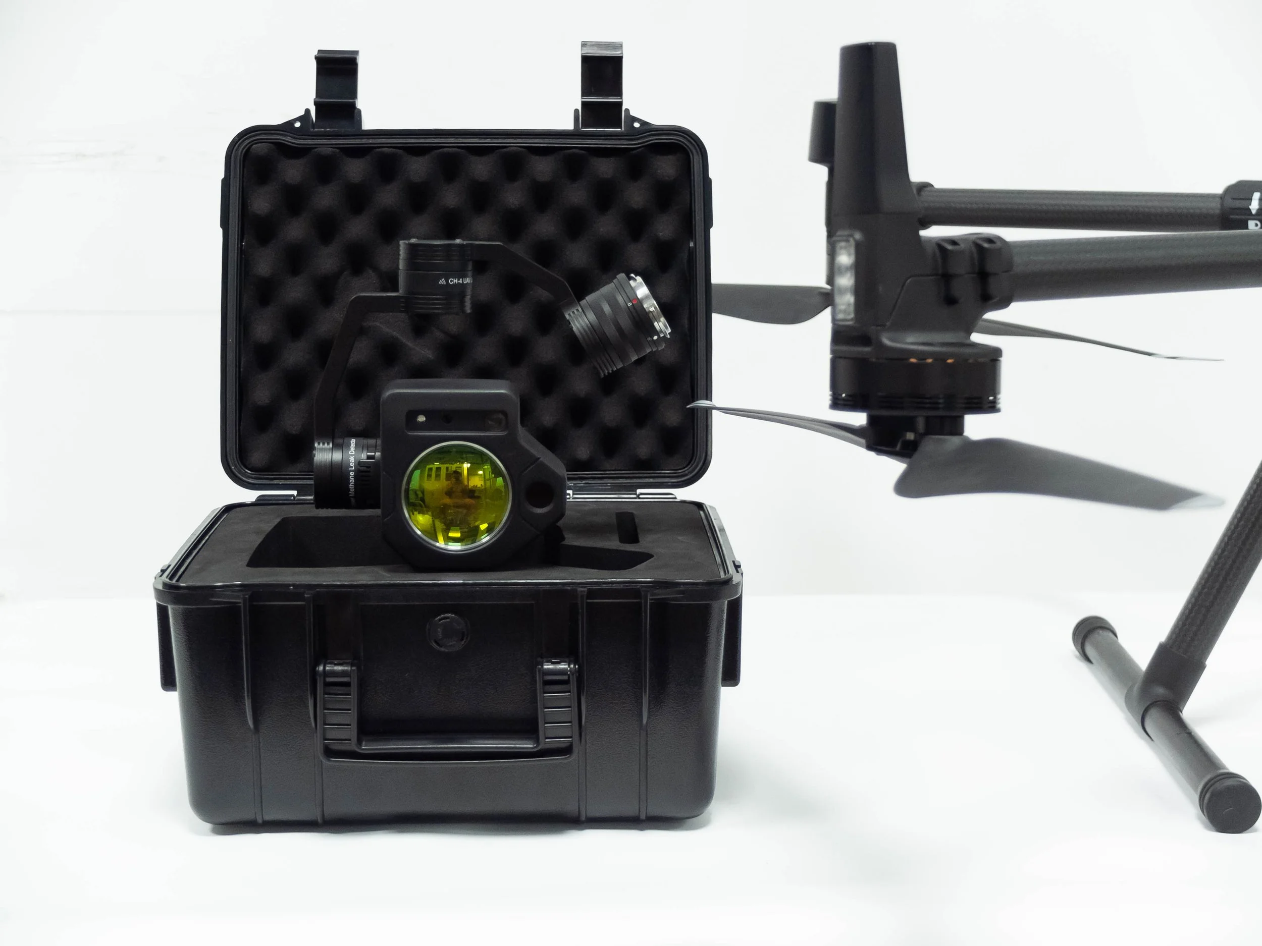 Purway UAV TDLAS methane detector Model II in a black box next to a enterprise drone