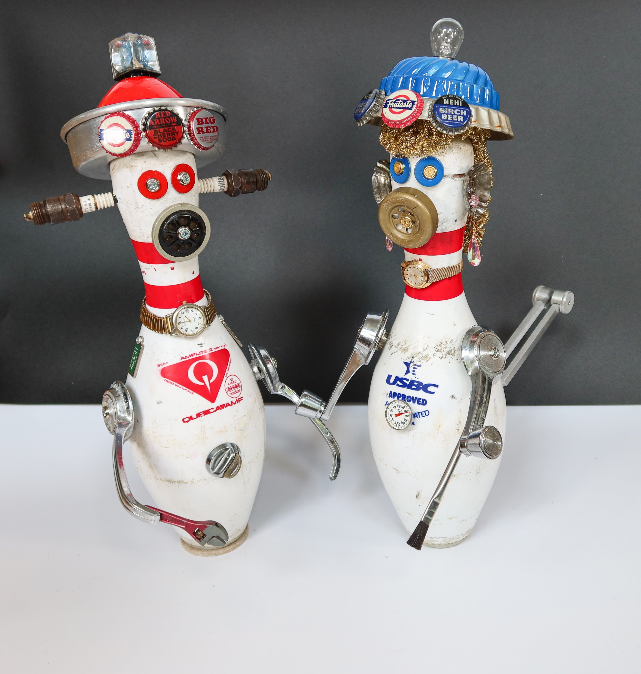 AVAILABLE. "Found Robots #6 & #7; Bob & Betty Bolin"
17" X 8" X 15" (each)
Bob Bolin has been a ‘car guy’ since he was a kid; he loves buying them, driving them, fixing them, and racing them, so no one was surprised that he became a Master Mechanic.