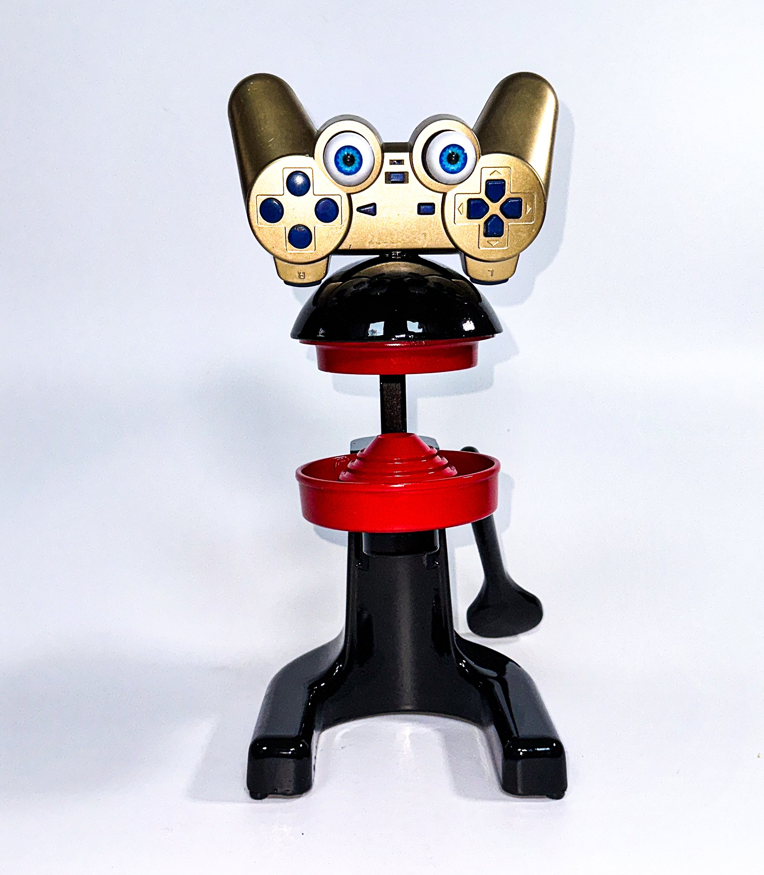 AVAILABLE; On exhibit now at the Old Sculpin Gallery!
"Cool Cat's got Game"
Vintage 1950’s Juice King juicer, PlayStation 2 game controller, doll eyes, paint, elbow grease.