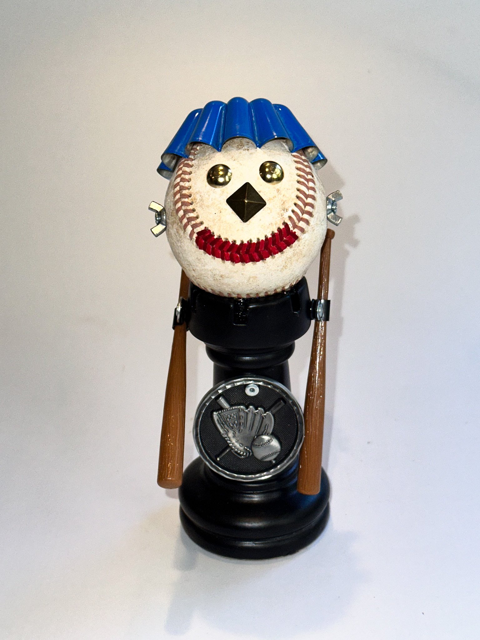 AVAILABLE: "Rookie of the Year"
8.5" X 3" X 4"
Extra-large Chess Rook, baseball, toy baseball bats, furniture nails, baking tin, baseball medal.