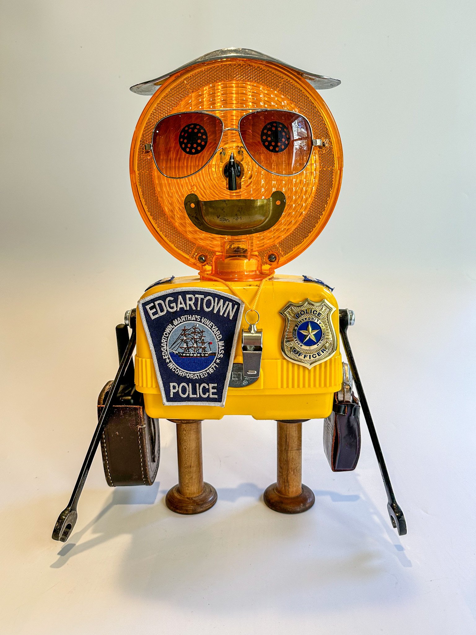 Introducing "Captain Copper" aka "The Loooong Arm of the Law"
17"T X 12"W X 6"D
AVAILABLE.
Constructed from"Dietz Visi-flash 670 Yellow Barricade Safety Light, Garlic press, plaster washers, sunglasses, drawer pull, rheostat knob, wrenches, toy gu