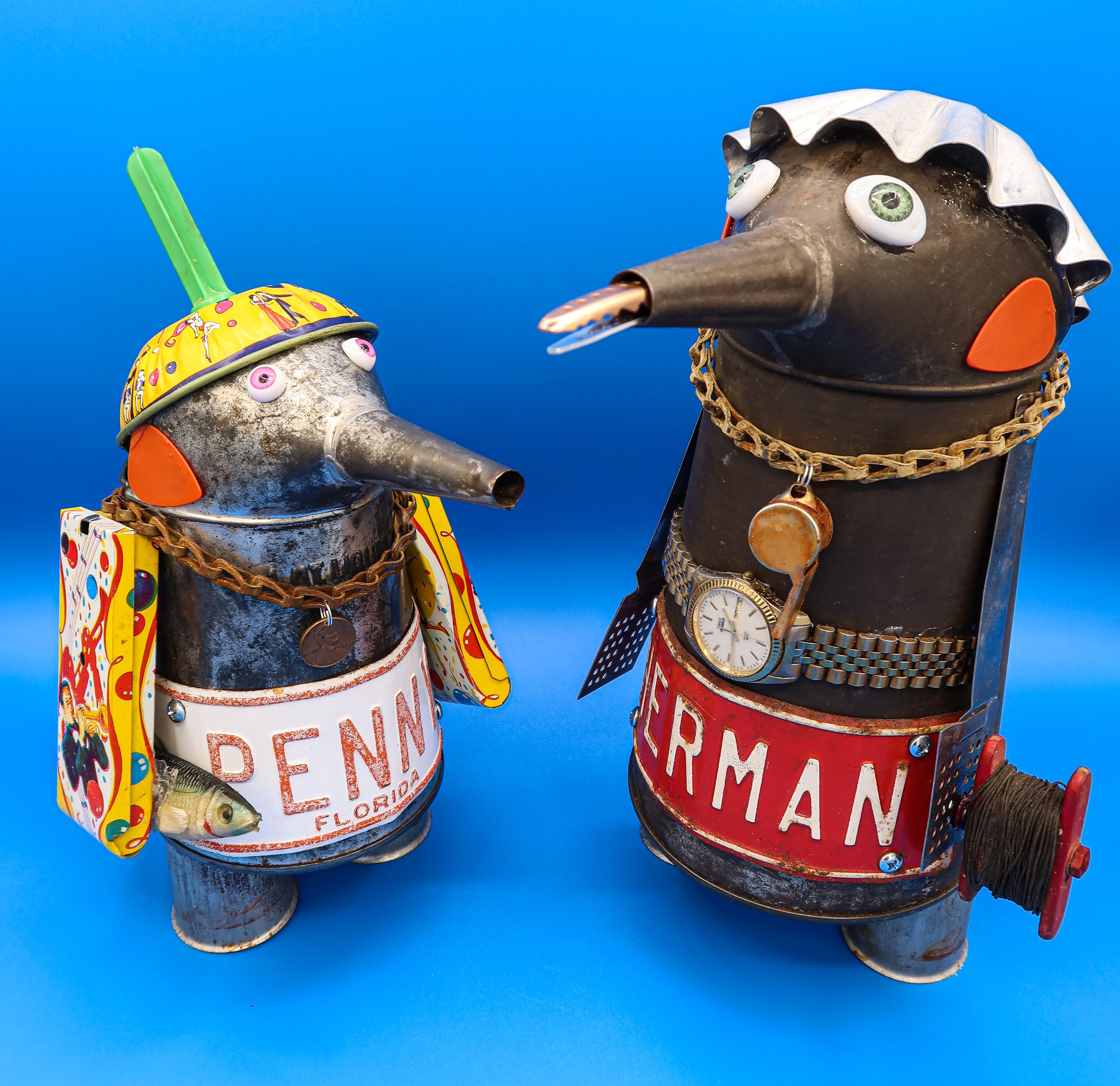 SOLD. "Penny and Her Man"
P: 10.5"T X 7"W X9"D. H: 13"T X 7.5"W X 13"D.
Vintage pitchers, antique license plates, vintage noisemakers, sash chains, guitar picks, doll eyes, watch, baking cup, hair clamp, drop line, fishing lure, whistle.