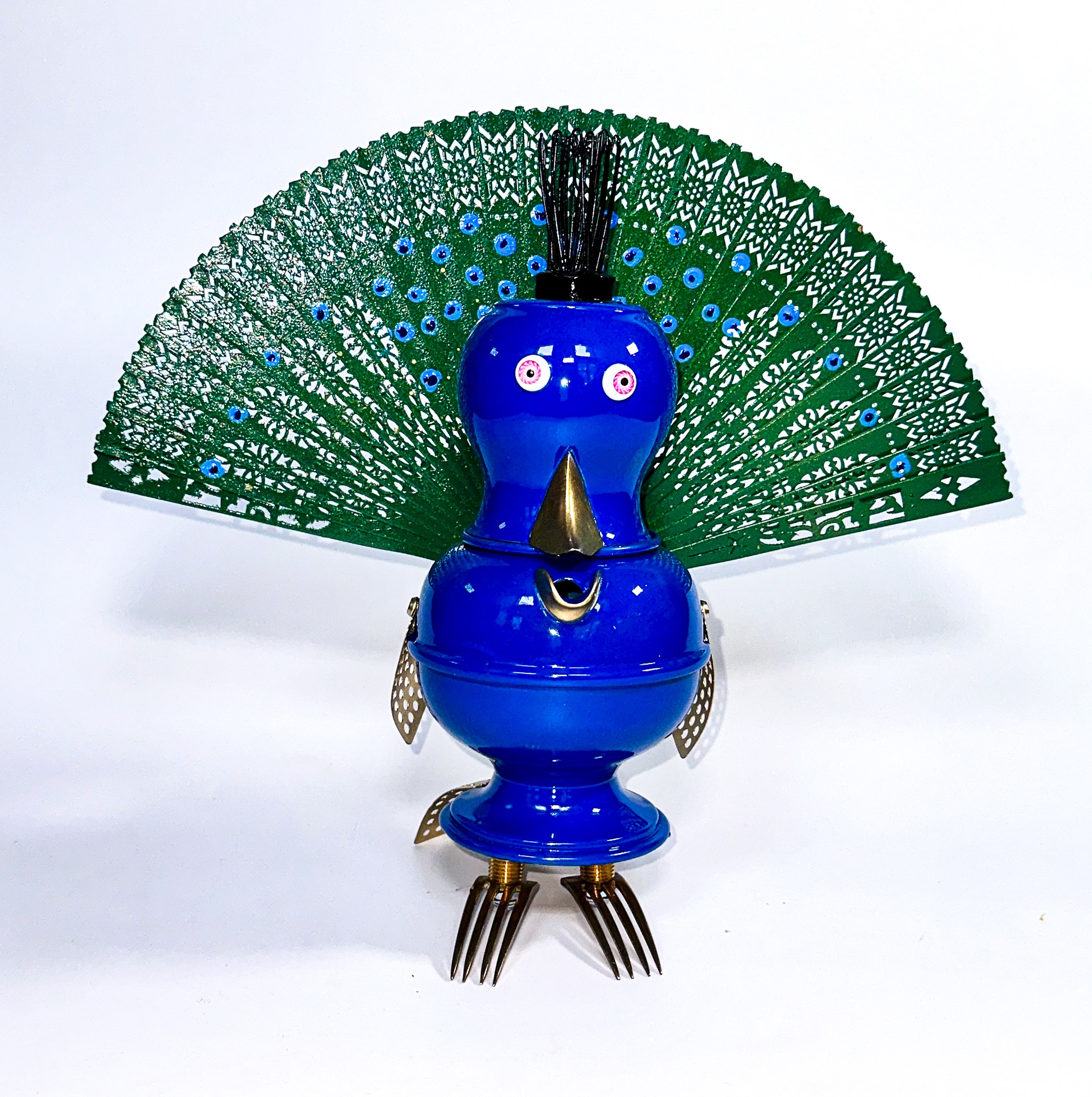 AVAILABLE; Never before exhibited!
"Percival Patrick Preston Peacock IV"
11 X 14 X 6
Antique pewter pitchers, brass hose barbs, brass forks, folding fan, doll eyes, Vintage Metal Hairpin-Type Flower Frog.